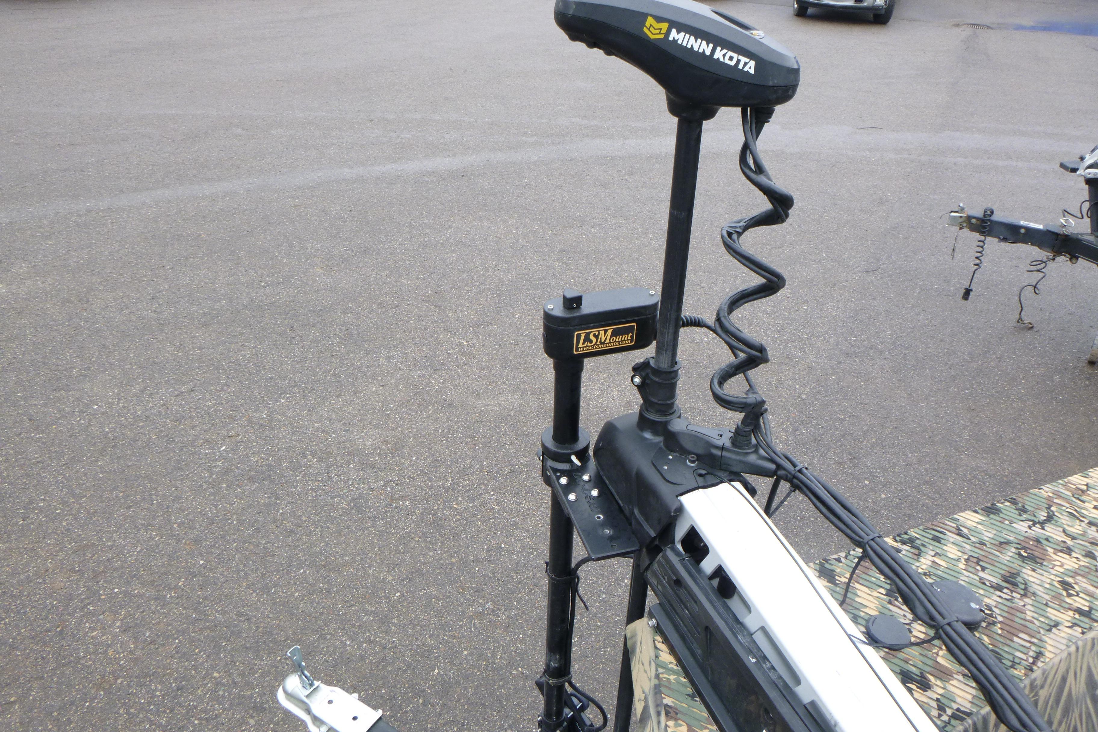 2024 Lowe Roughneck 2070 with Minn Kota trolling motor and LSMount on pavement.