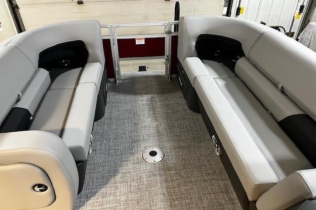 2026 Sun Tracker SportFish 22 DLX interior with gray seating and spacious layout.
