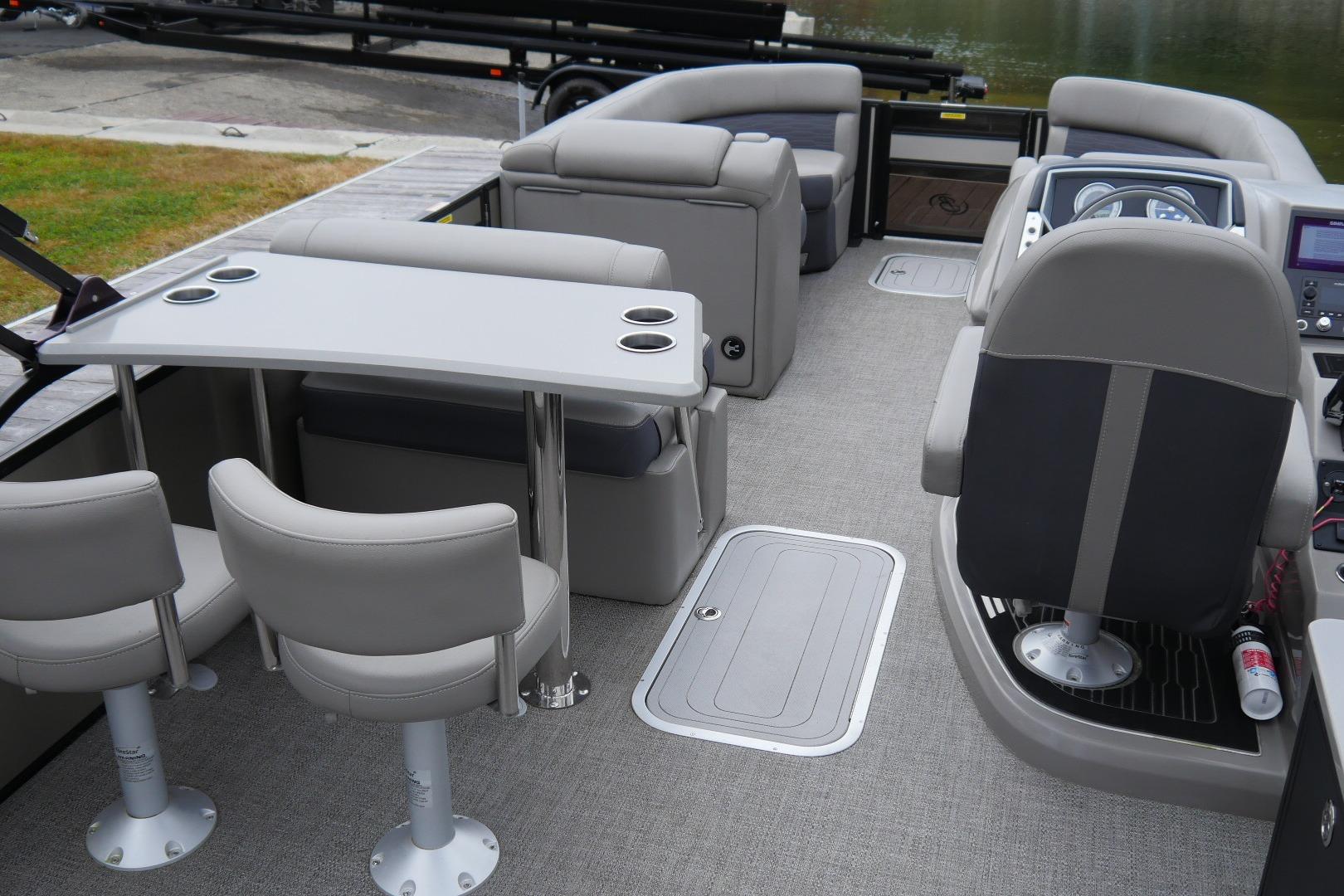 2023 Barletta CORSA 25UE pontoon boat interior with seating and helm.