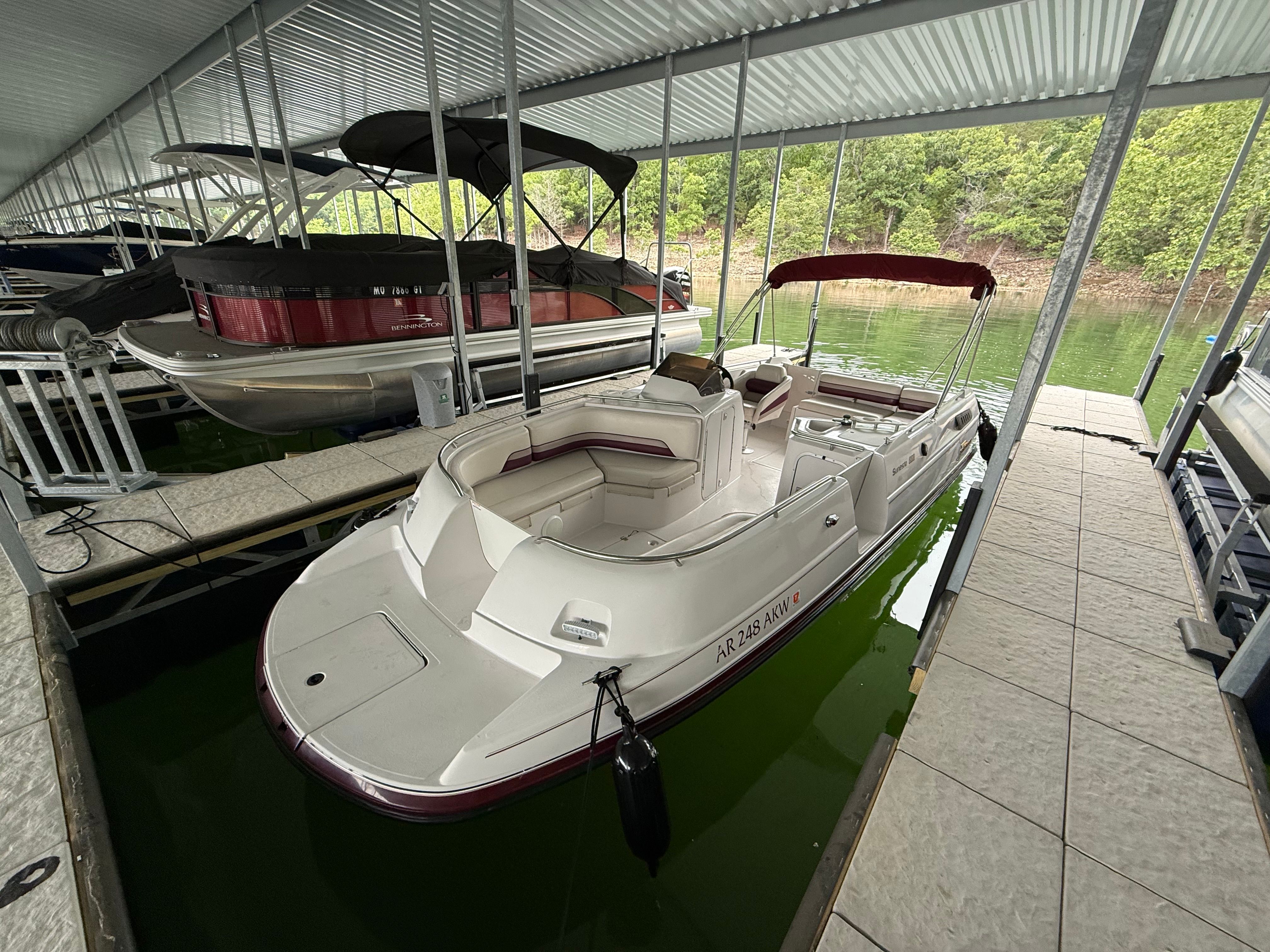 1994 Chaparral Sunesta 220 in a covered boat slip.