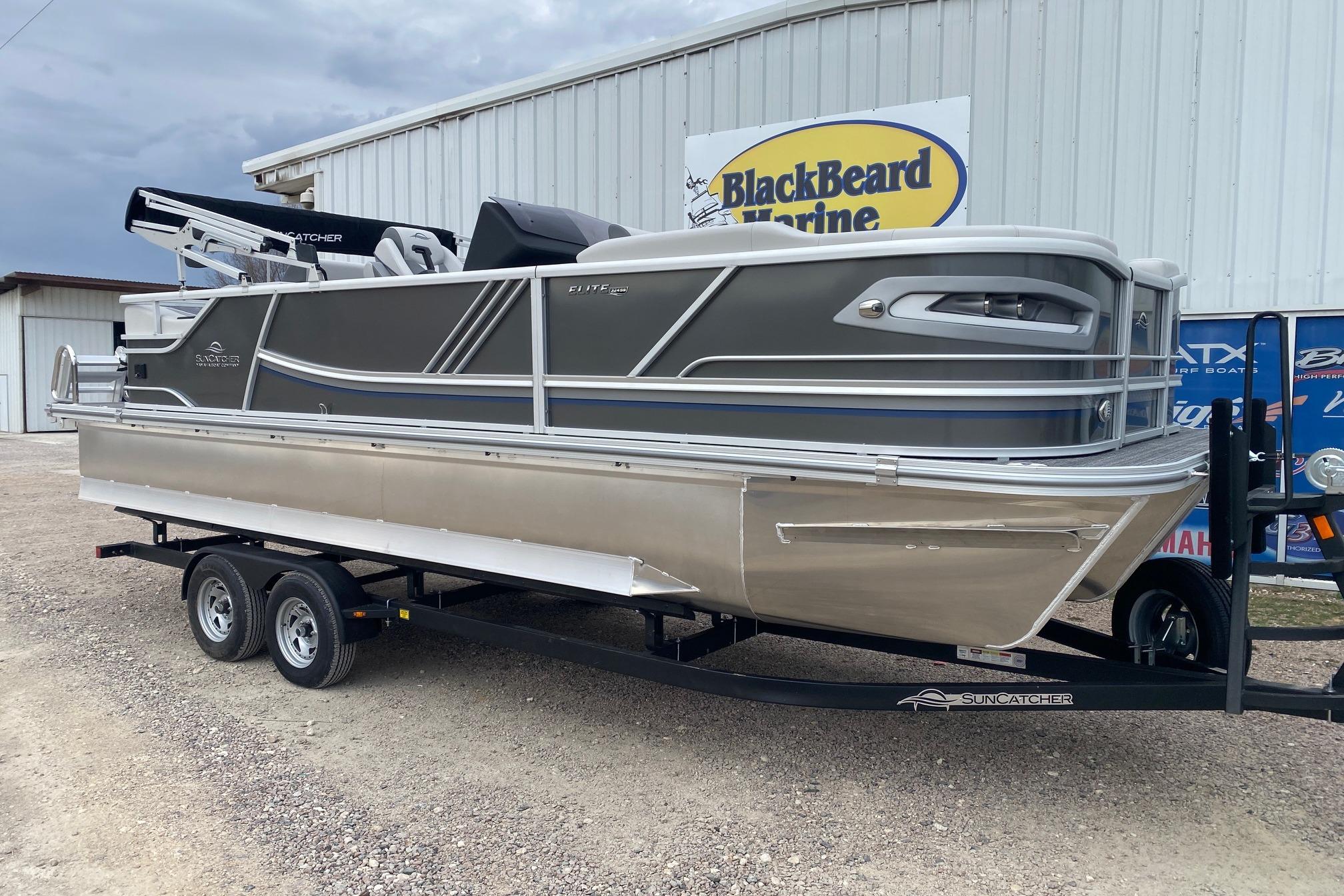 2026 SunCatcher Diamond Elite 324 SS pontoon boat on trailer at BlackBeard Marine.