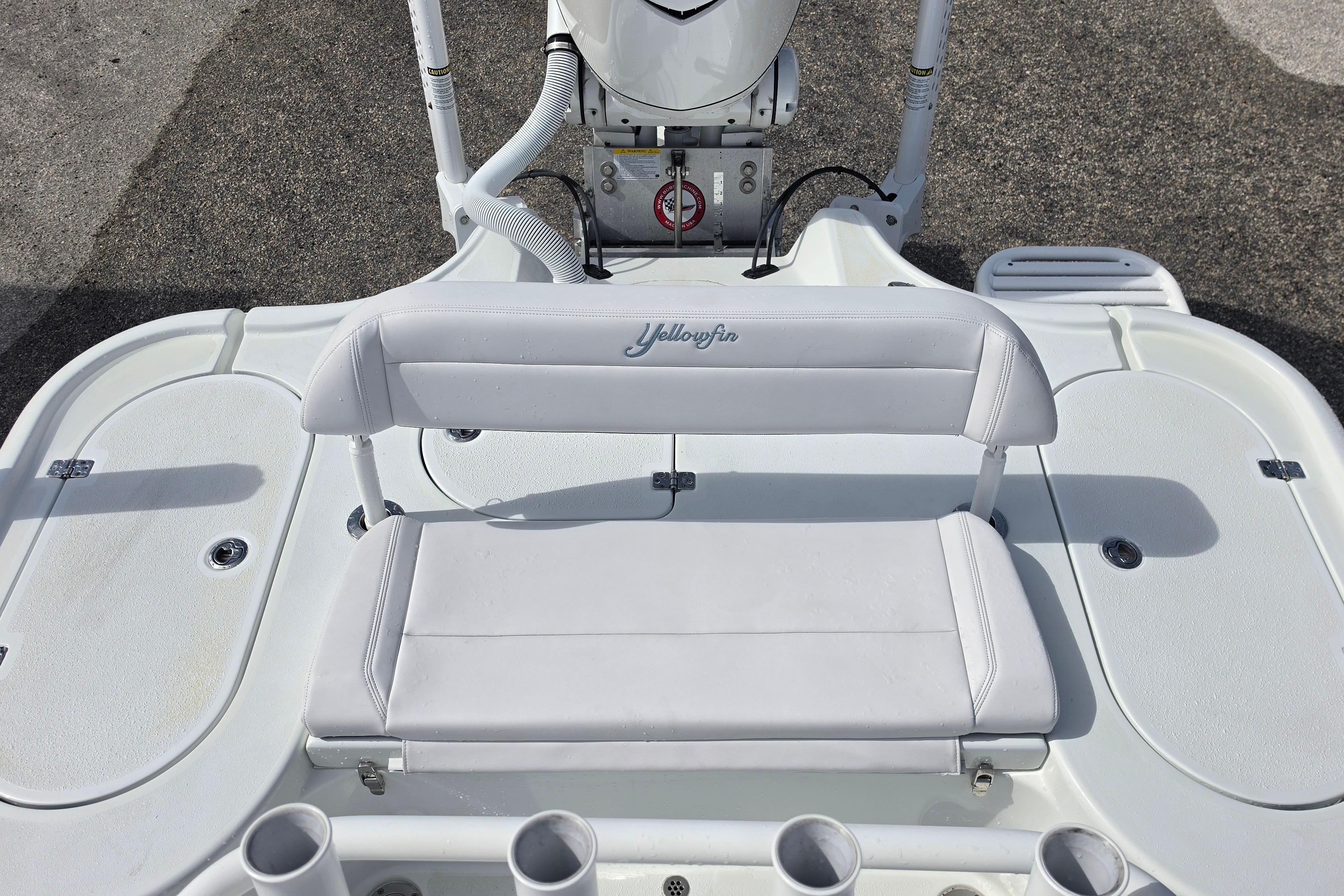 2026 Yellowfin 24 Bay CE boat interior with white seating and rod holders.