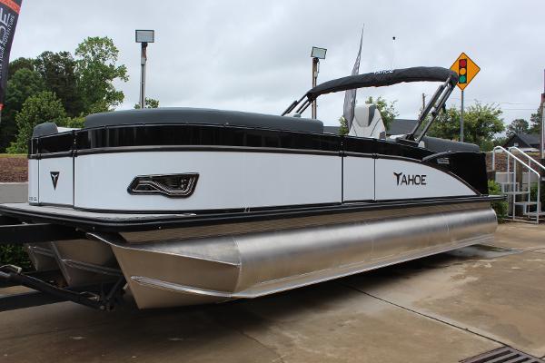 2025 Tahoe Pontoon Cascade Quad Lounger, sleek design, parked outdoors.