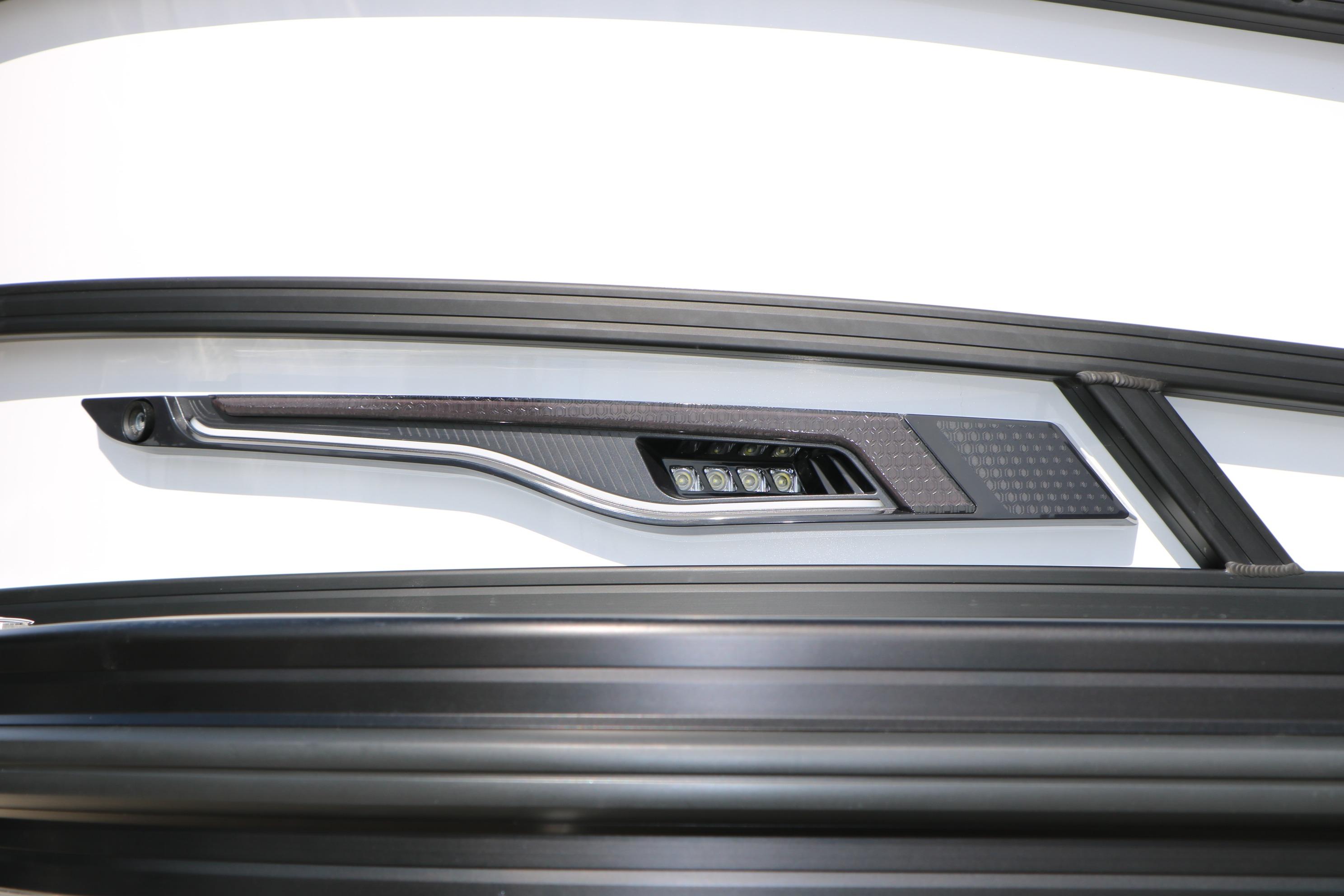 Close-up of 2026 Evotti 725 CS Tri-Toon boat detail with sleek design elements.