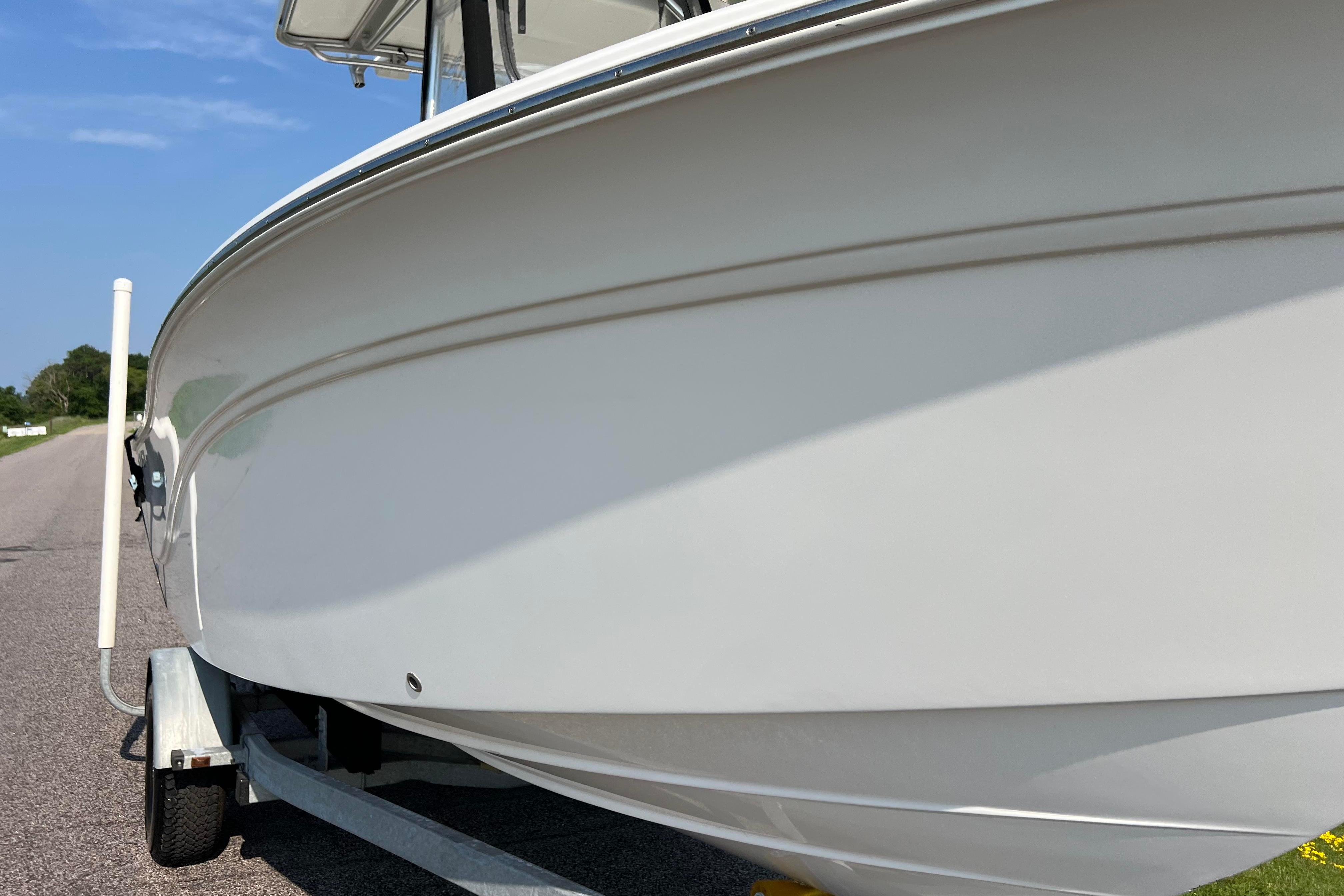 2012 Sea Fox 206 Center Console boat on trailer, side view.