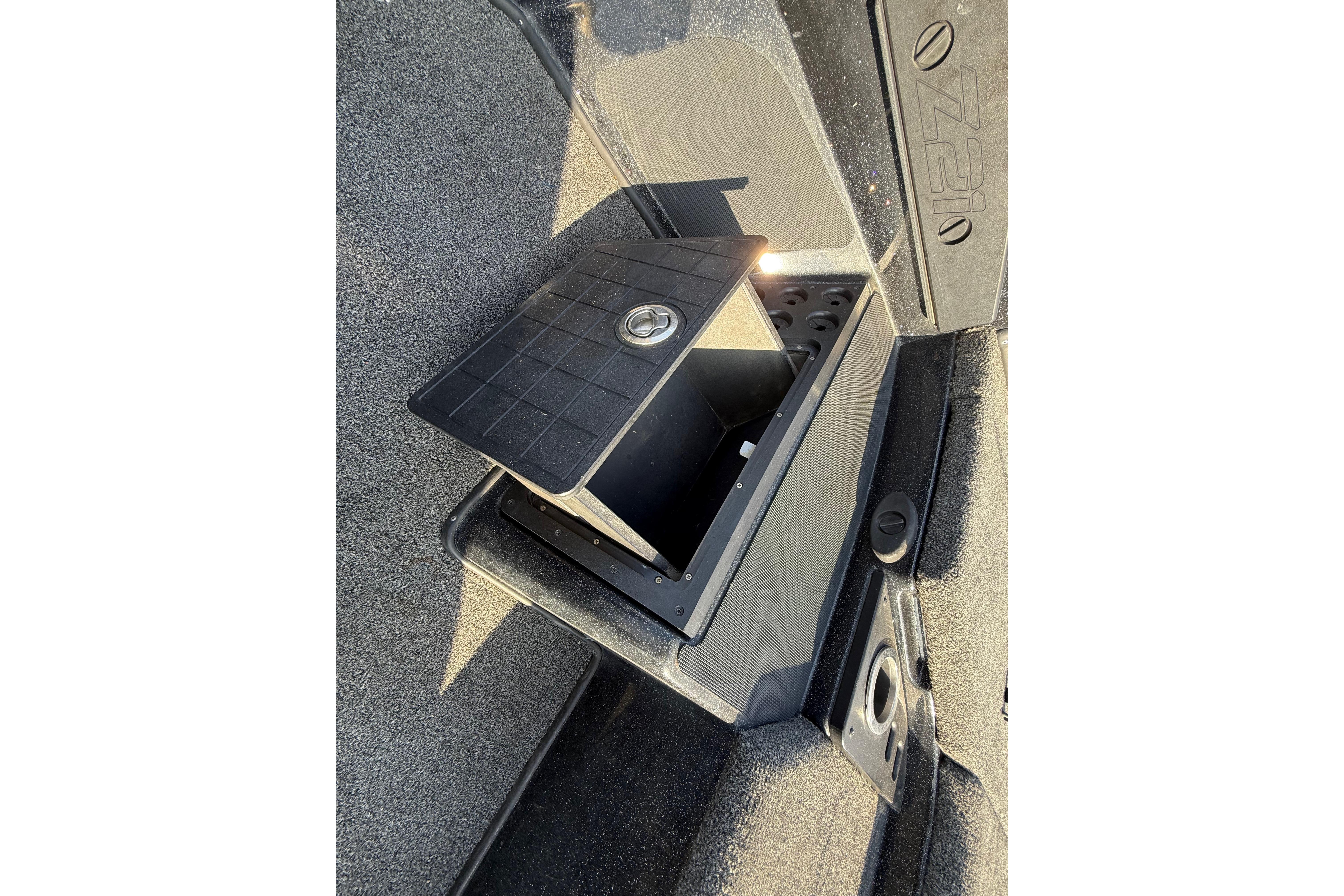 2019 Nitro Z21 Pro boat storage compartment with open lid, showcasing interior space.
