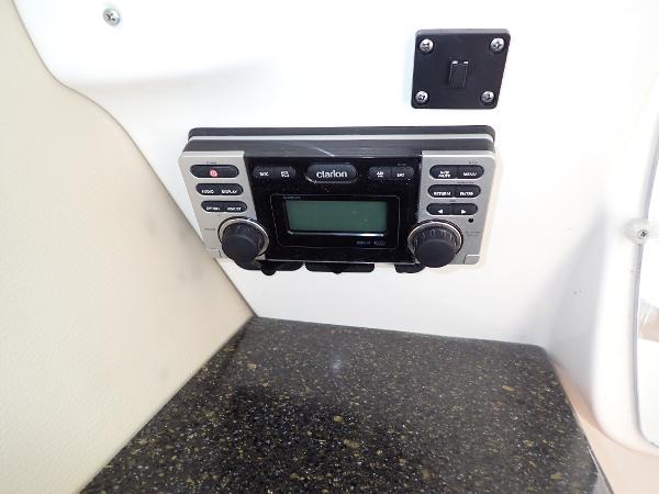 Clarion stereo system on 2011 Chaparral 287 SSX boat dashboard.