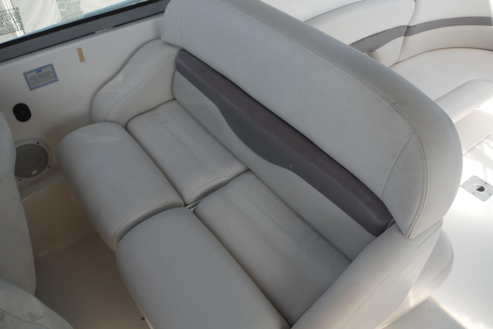 2005 Chaparral Signature 350 boat interior with white cushioned seating.