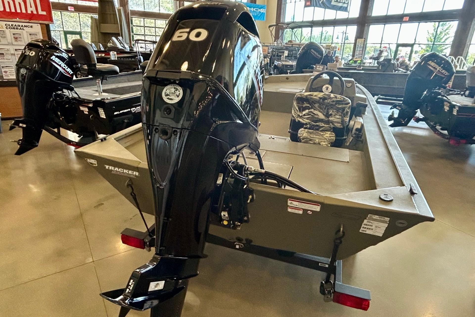 2026 Tracker Grizzly 1754 SC boat with Mercury 60 engine in showroom.