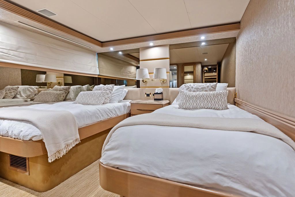 Luxurious bedroom on a 1999 Westport 112 yacht.