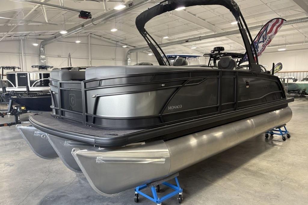 2026 Godfrey Monaco 235 SFLC iMPACT 2.0 pontoon boat in showroom.