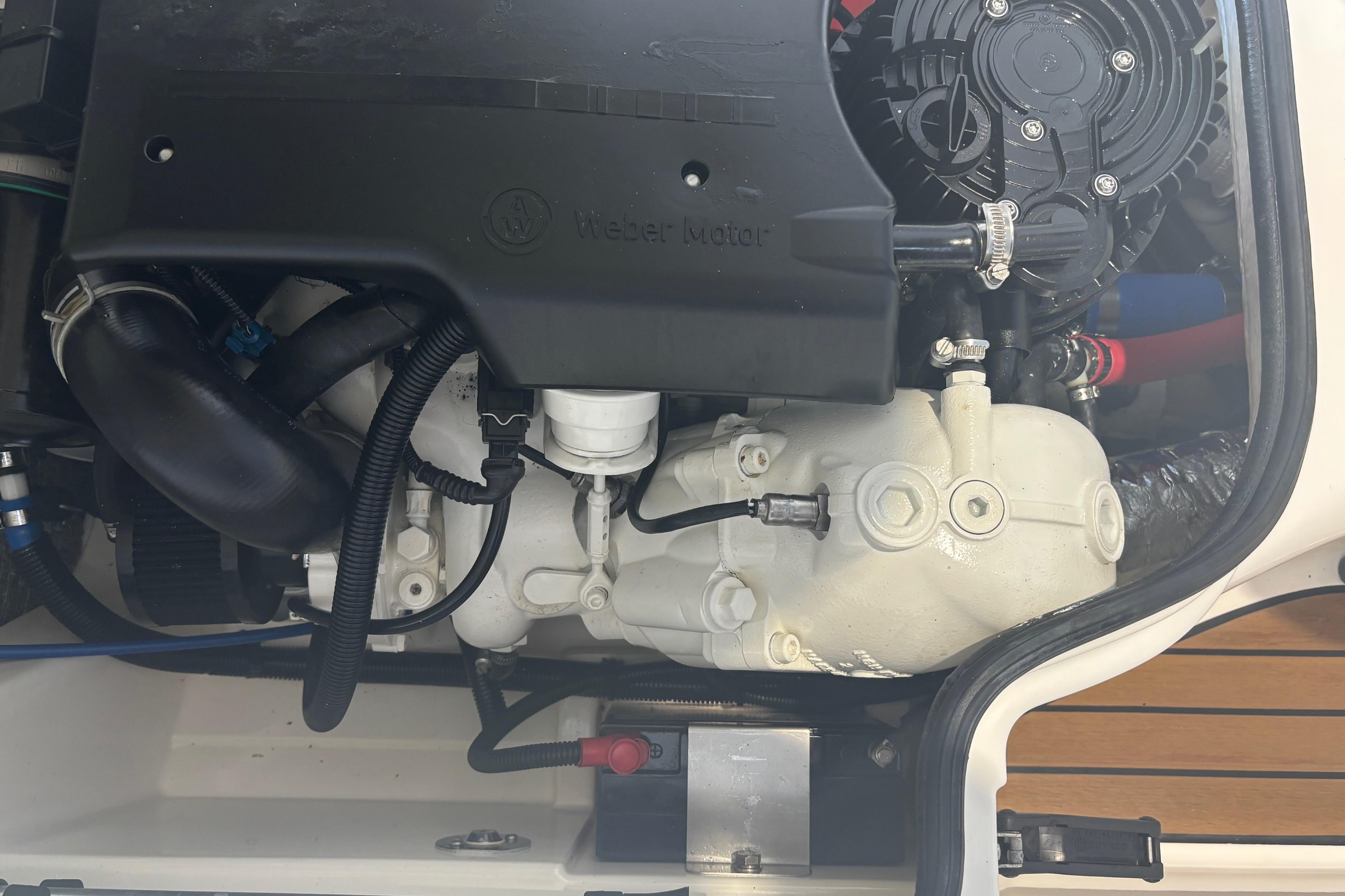Engine compartment of a 2014 Williams Jet Tenders Turbojet 325, showcasing mechanical components.