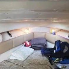 Interior of the 2006 Robalo R265 Walkaround with cozy seating and cushions.
