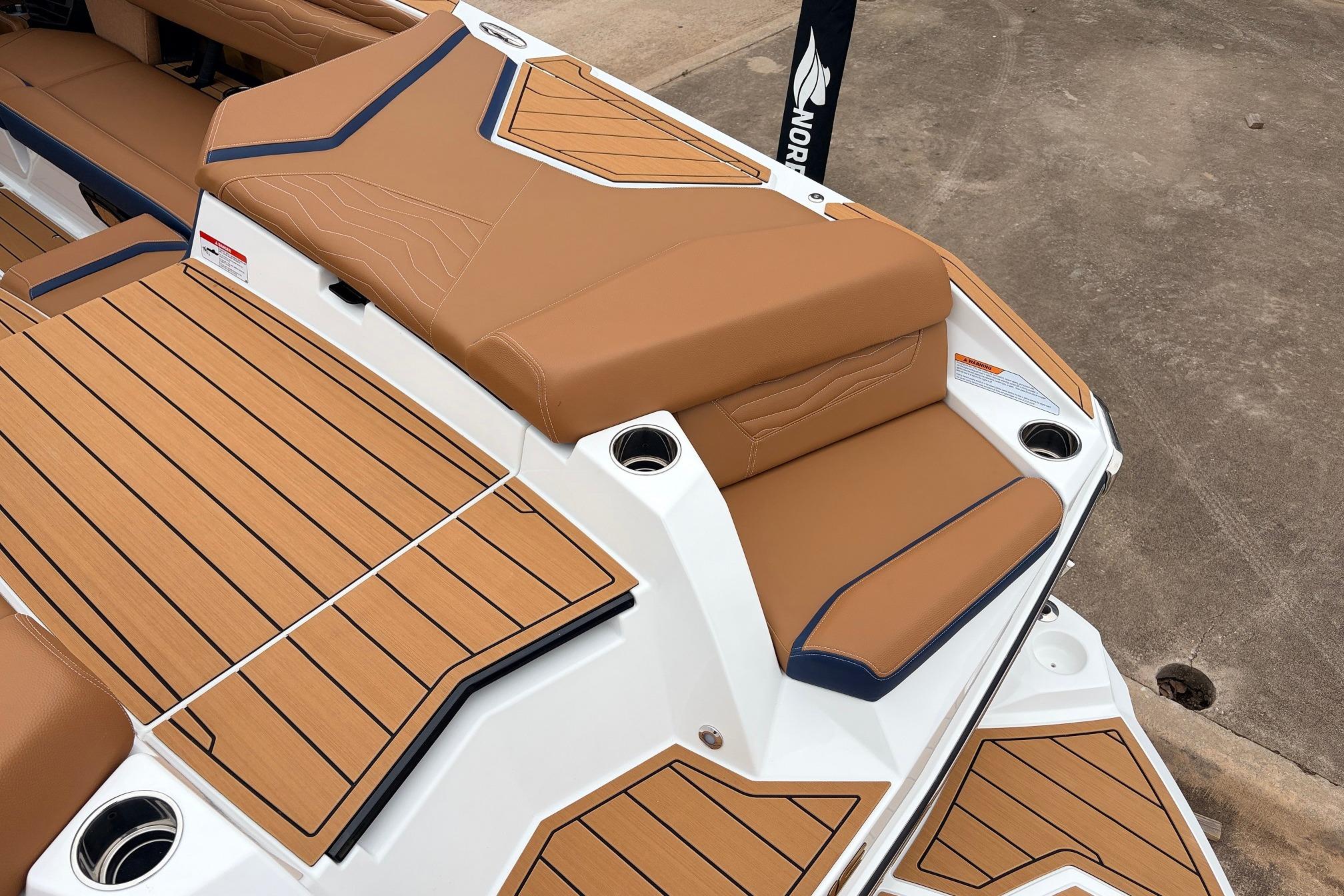 2026 Nautique Super Air Nautique G25 boat with tan seating and teak-style decking.