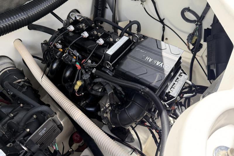 Engine compartment of a 2017 Yamaha Boats SX210, showcasing detailed wiring and components.