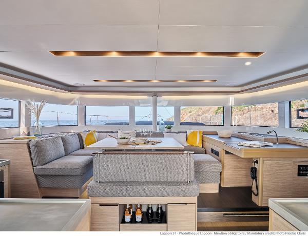 Luxurious interior of 2025 Lagoon 51 ICONIC yacht with modern design and panoramic windows.