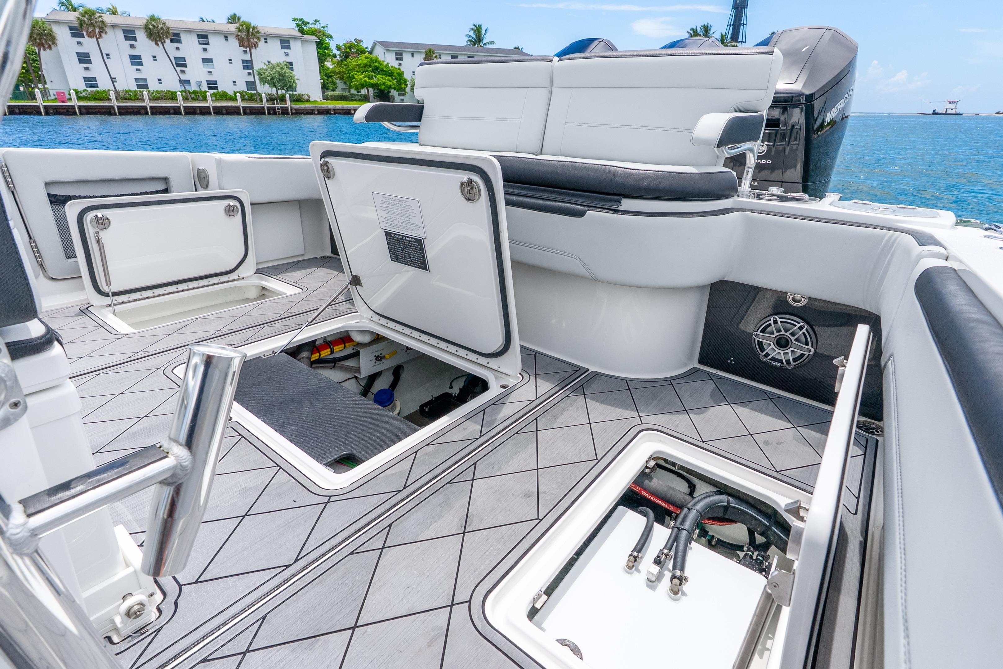 2024 Nor-Tech 452 Super Fish boat interior with open storage compartments and sleek seating.