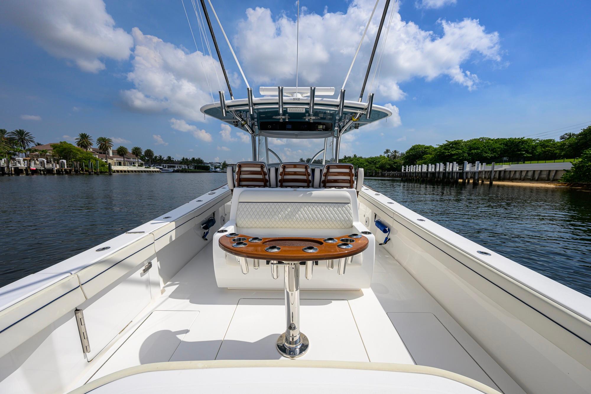 2020 Valhalla Boatworks V-41 on calm water, showcasing spacious deck and seating.