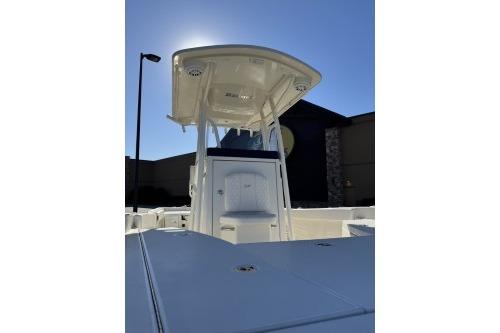 2025 Ranger 2510 Bay boat with T-top, viewed from the deck under clear blue sky.