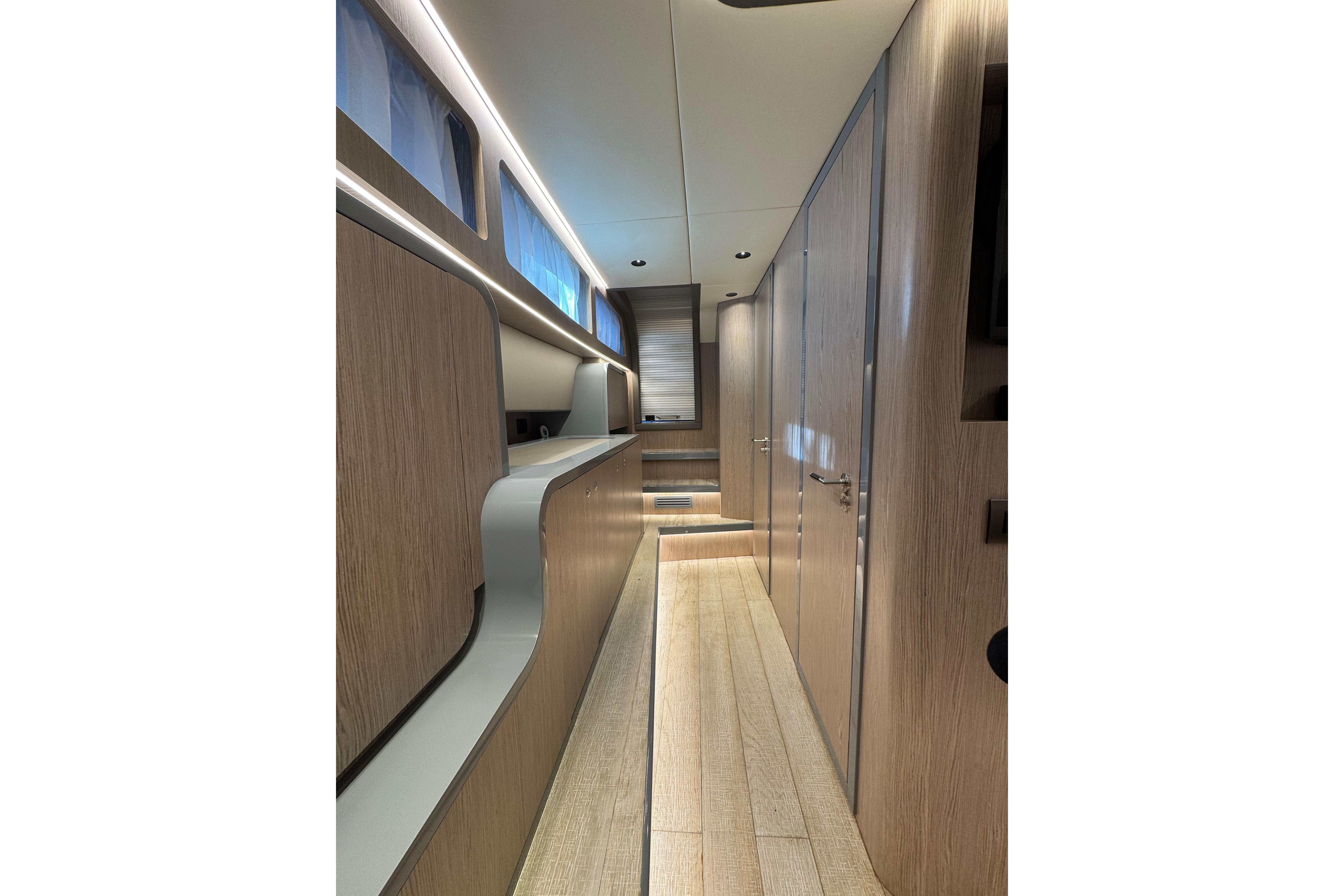 Luxurious interior of 2023 Canados 43 yacht, featuring sleek wood finishes and modern design.