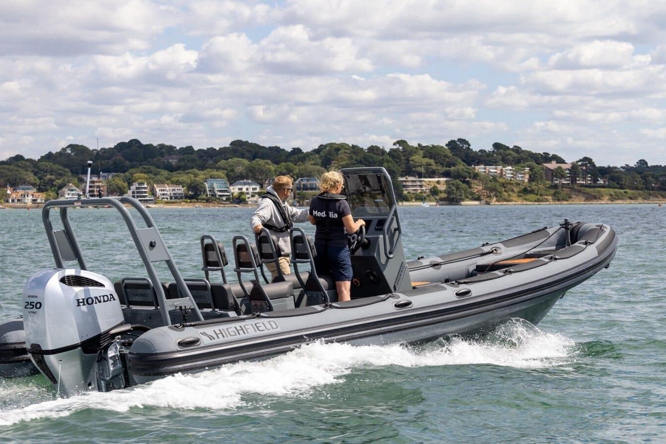 2026 Highfield Patrol 760 boat cruising on water with Honda engine.