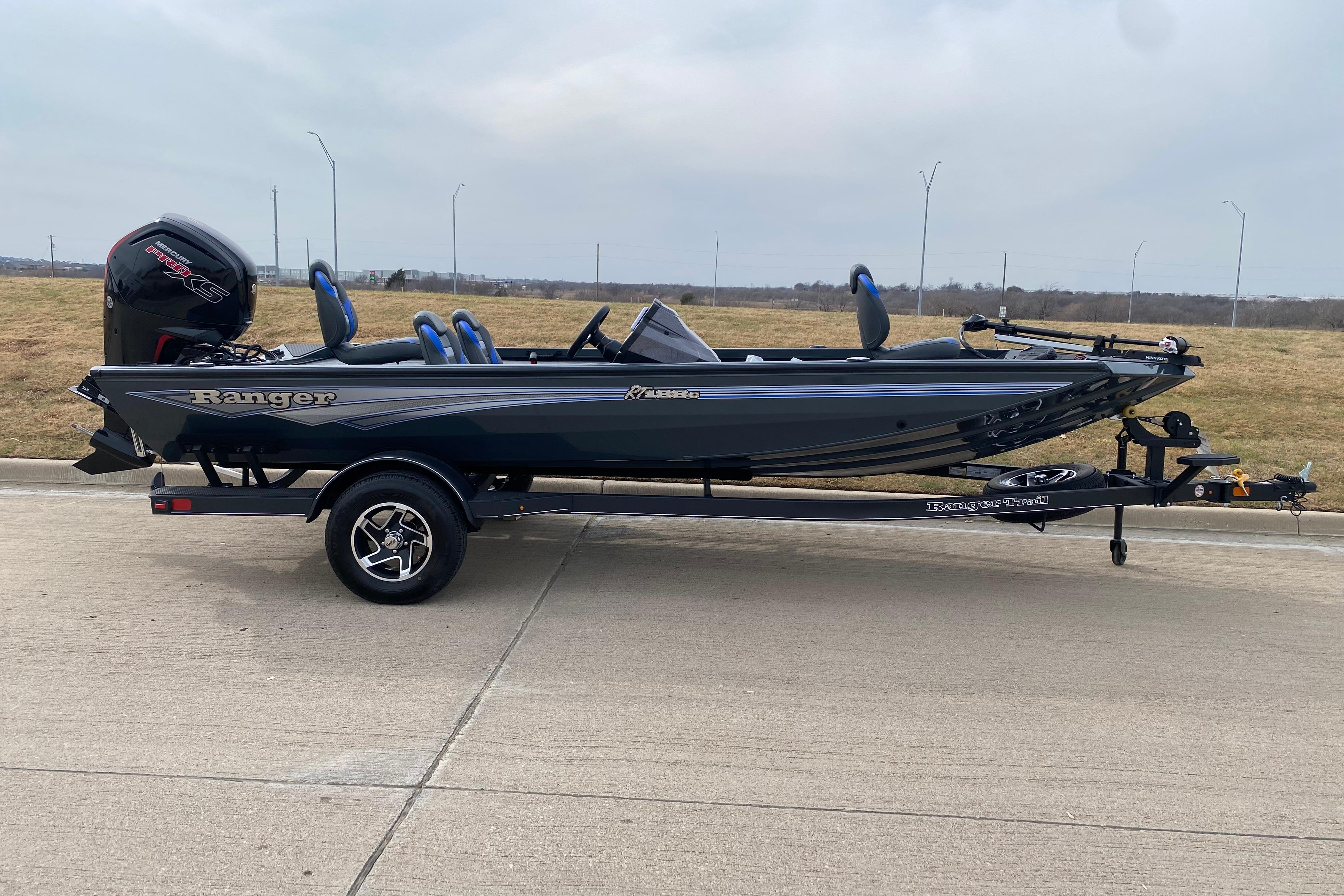 2026 Ranger RT188C fishing boat on trailer, parked on concrete surface.