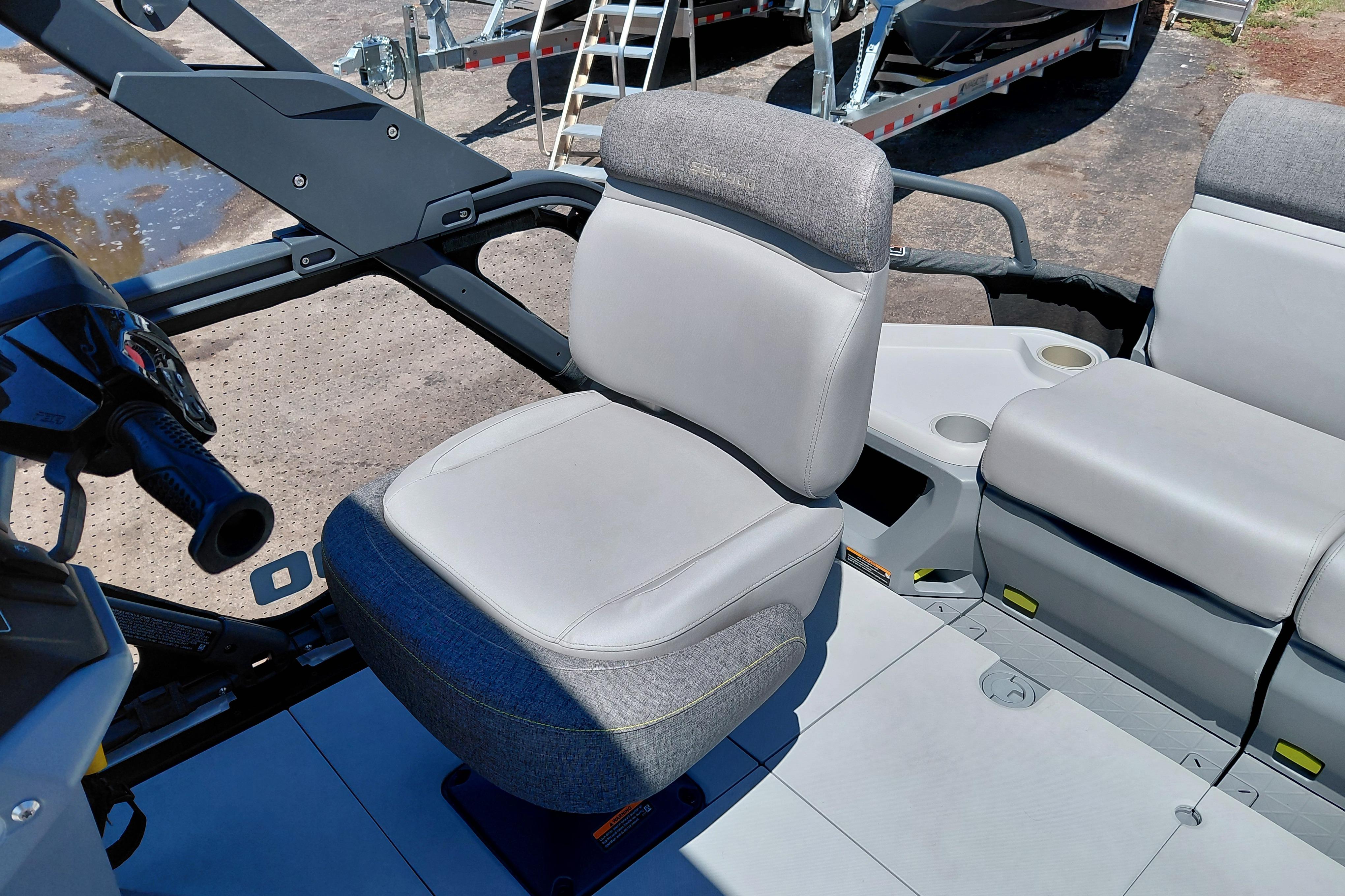 2024 Sea-Doo Switch Cruise 18 interior seating with steering console and cup holders.