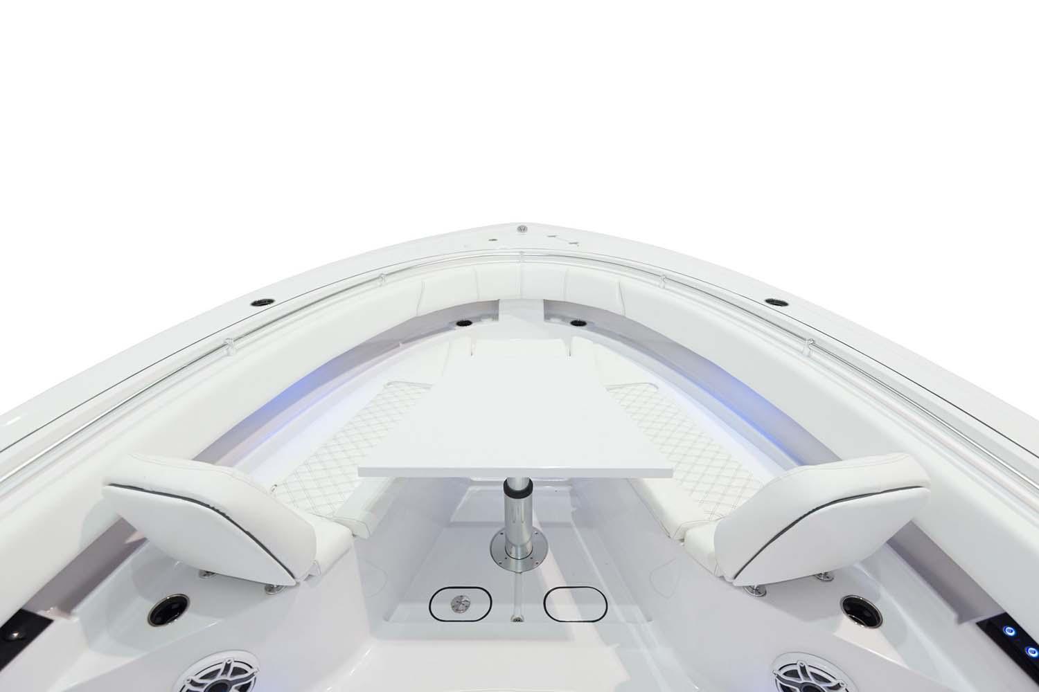 Manufacturer Provided Image: 2025 Sportsman Open 322 Center Console boat interior with seating and table.