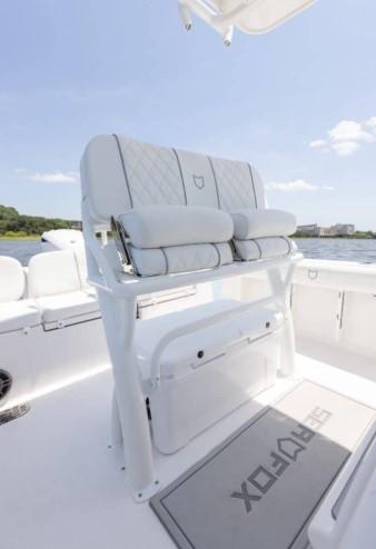 2026 Sea Fox 228 Commander boat interior with cushioned seating and Sea Fox branded mat.