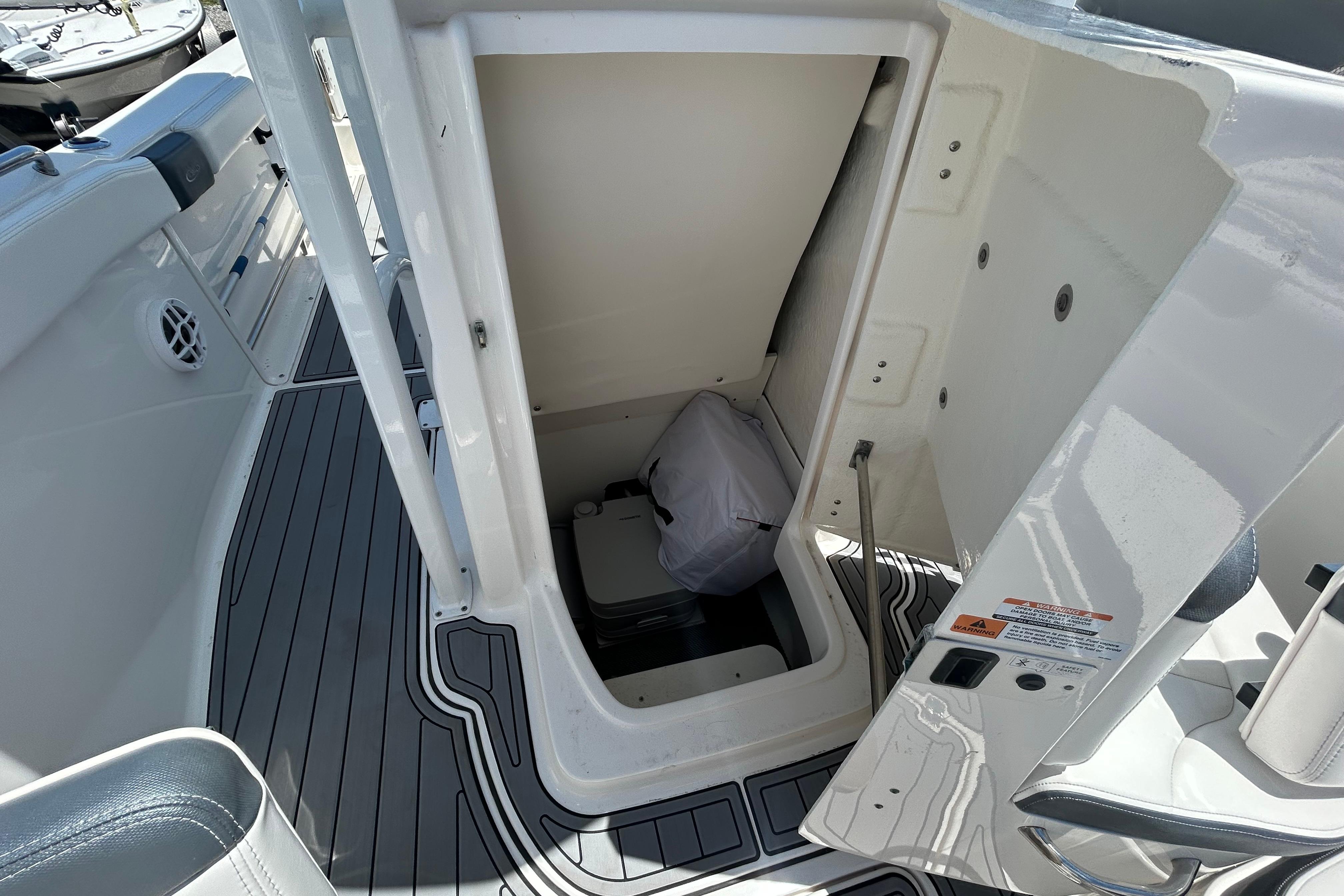 2021 Robalo R222 Explorer boat storage compartment with open hatch and visible interior.