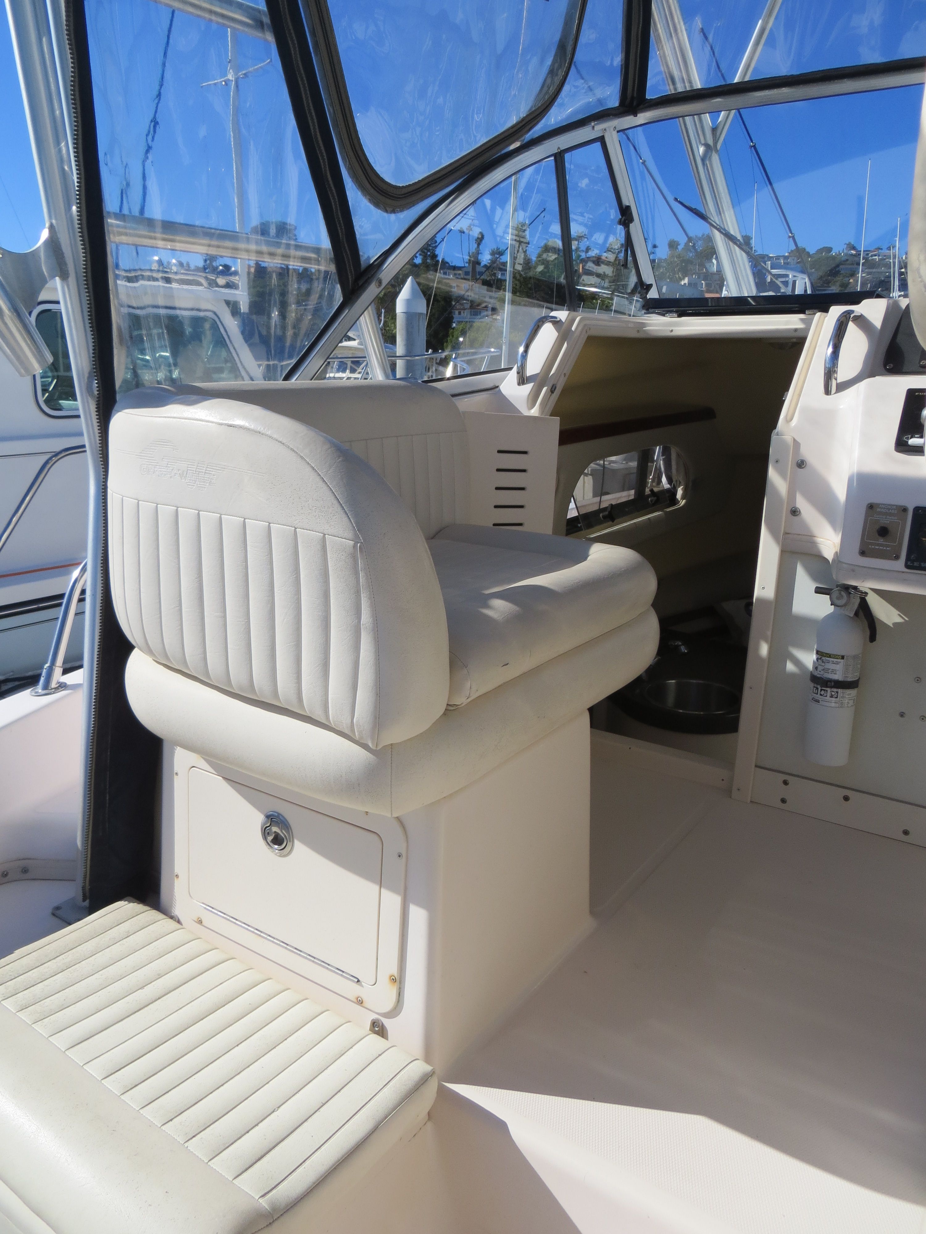 A 2007 Grady-White Sailfish 282 with a white seat and helm area.