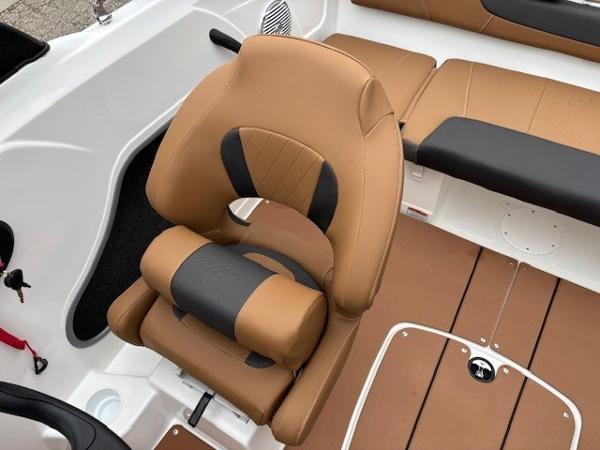 2025 Tahoe 185 S boat interior with tan and black seating, showcasing modern design and comfort.