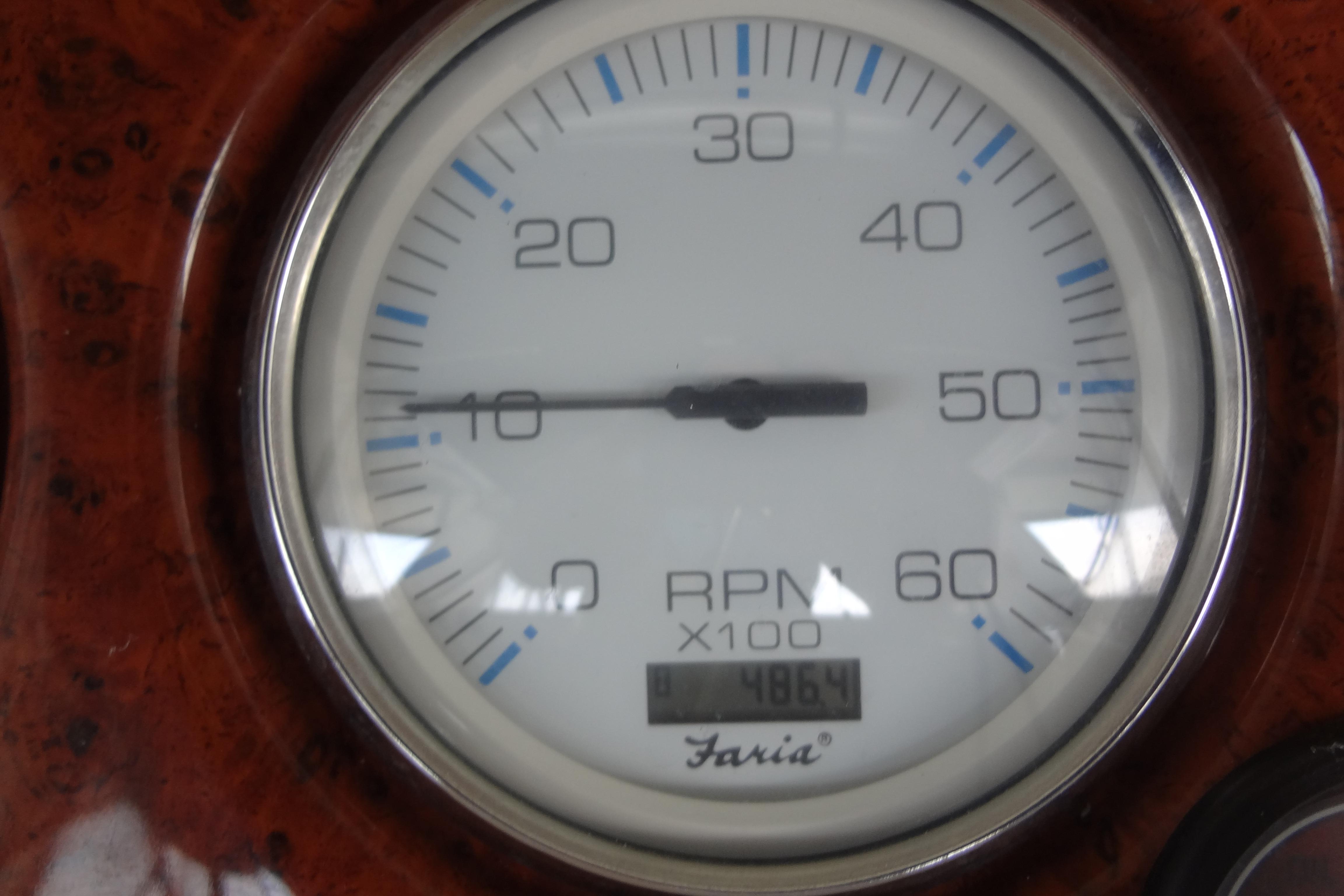Tachometer of 2005 Silverton 34 Convertible boat, displaying RPM and hours.
