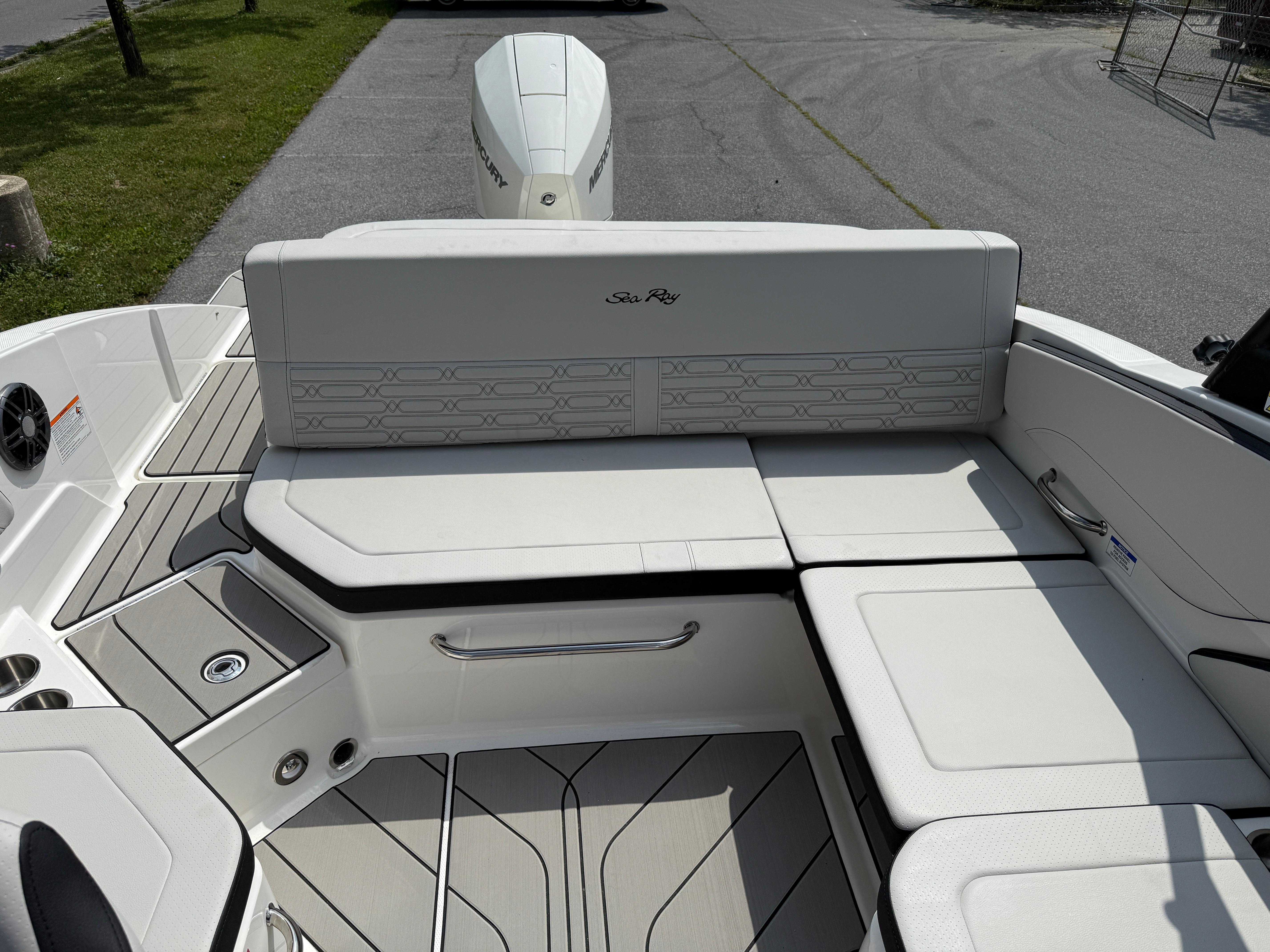 2026 Sea Ray SPX 210 Outboard boat interior with white seating and sleek design.