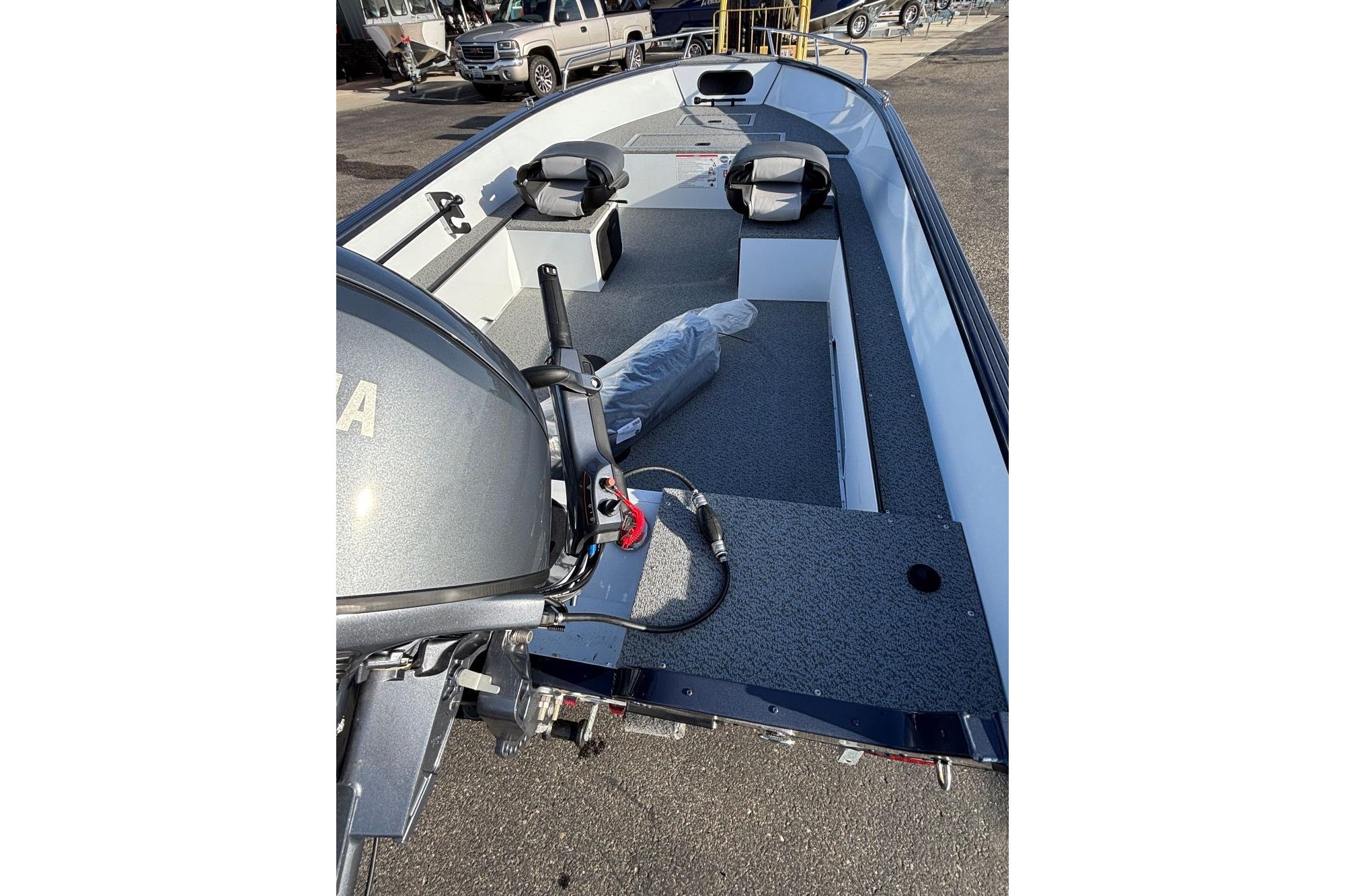 2026 Smoker Craft Pro Lodge 160 boat interior with motor and seating.