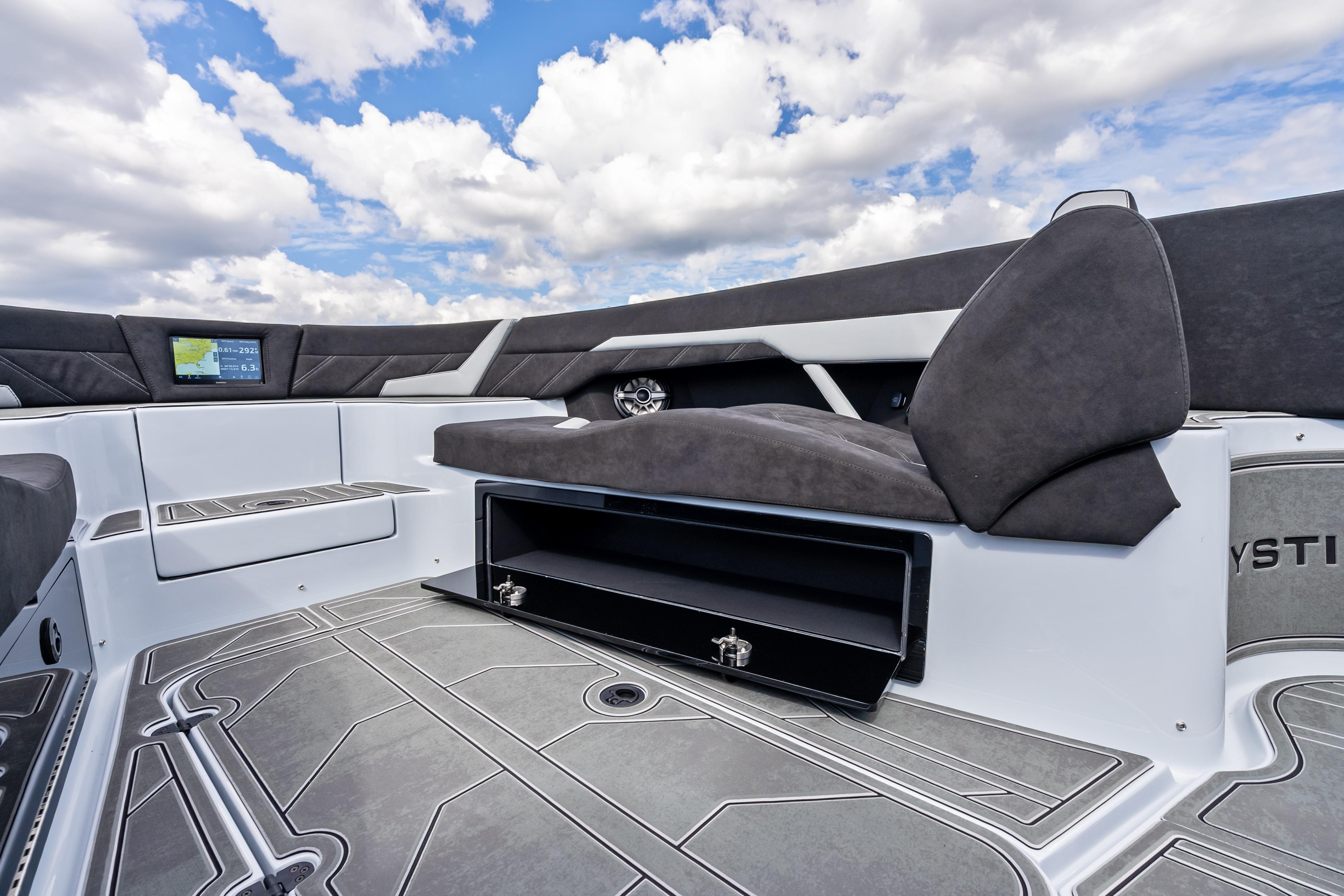 2027 Mystic Powerboats M4200 interior with sleek seating and modern navigation display.