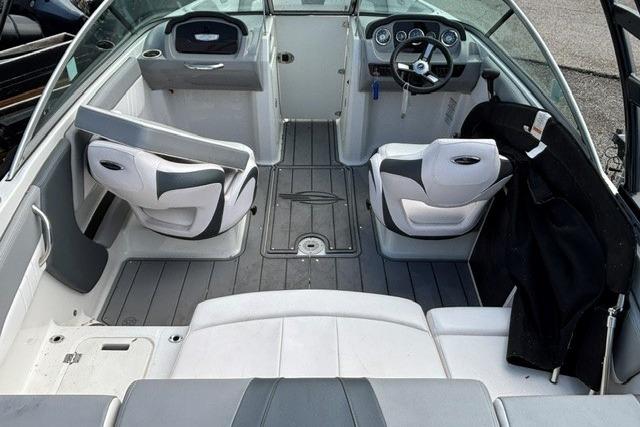 Interior of a 2021 Chaparral 21 SSi boat with modern seating and dashboard.