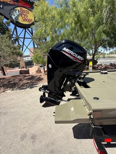 2025 Tracker Grizzly 1860 CC boat with Mercury outboard motor near Bass Pro Shops.