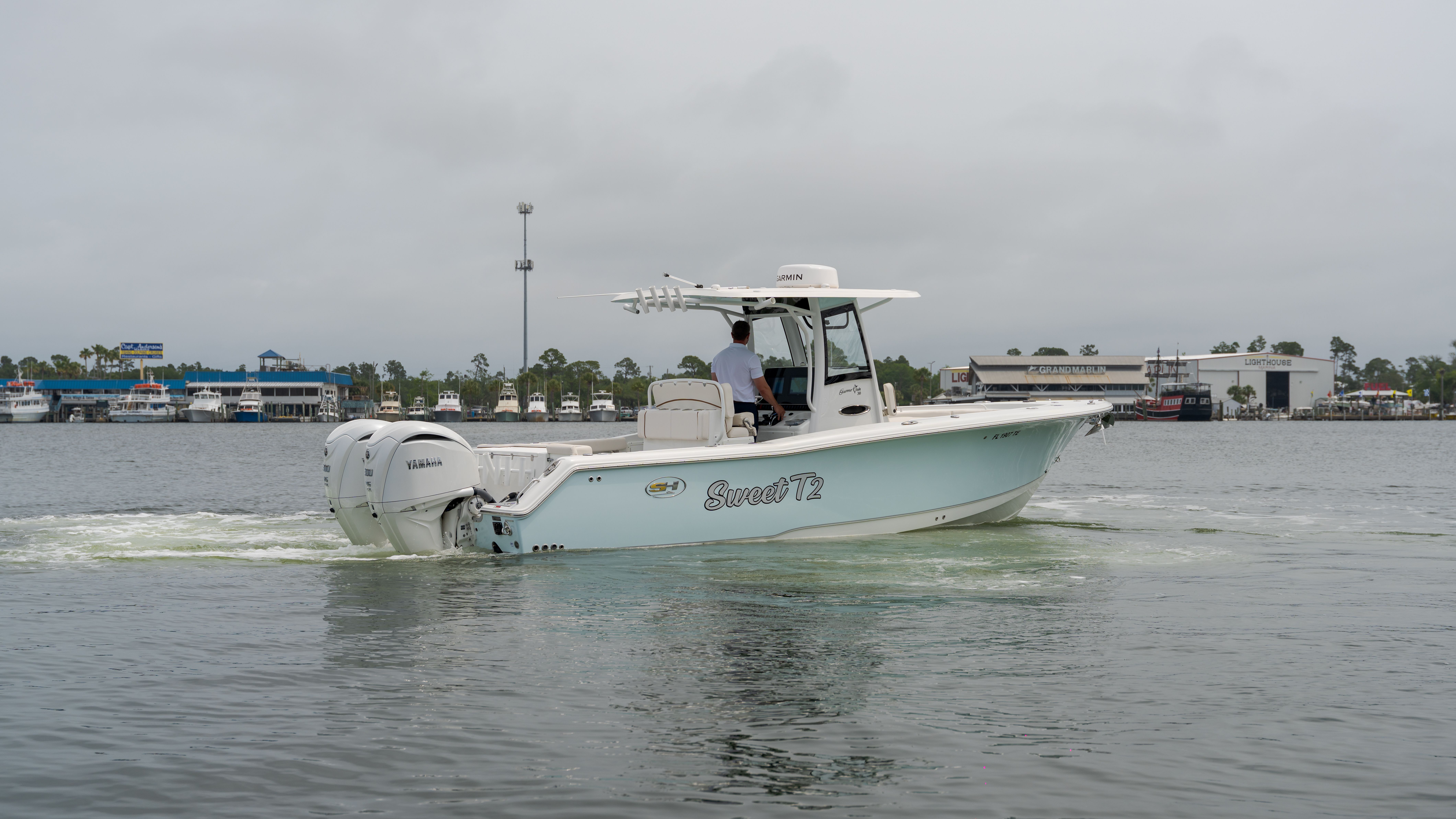 2022 Sea Hunt Gamefish 30 boat on calm waters.