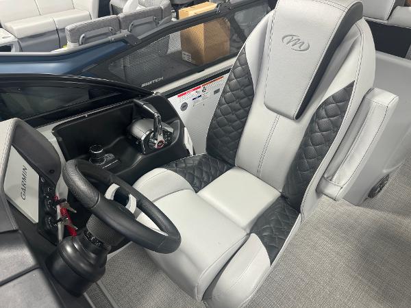 2025 Manitou LX boat interior with luxury seating and advanced controls.