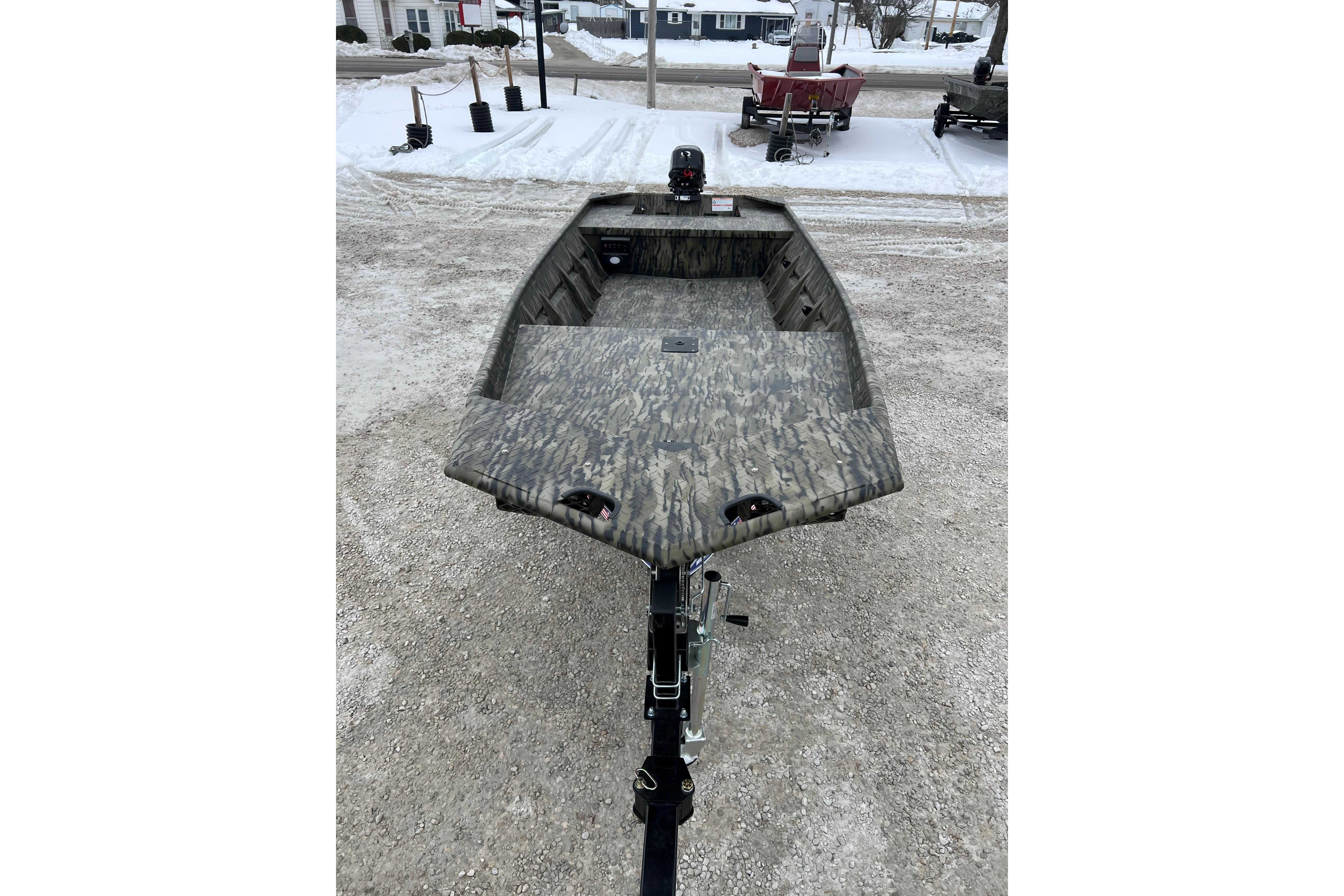 2026 SeaArk 1648 MV Special boat on snowy ground, showcasing camouflage design.