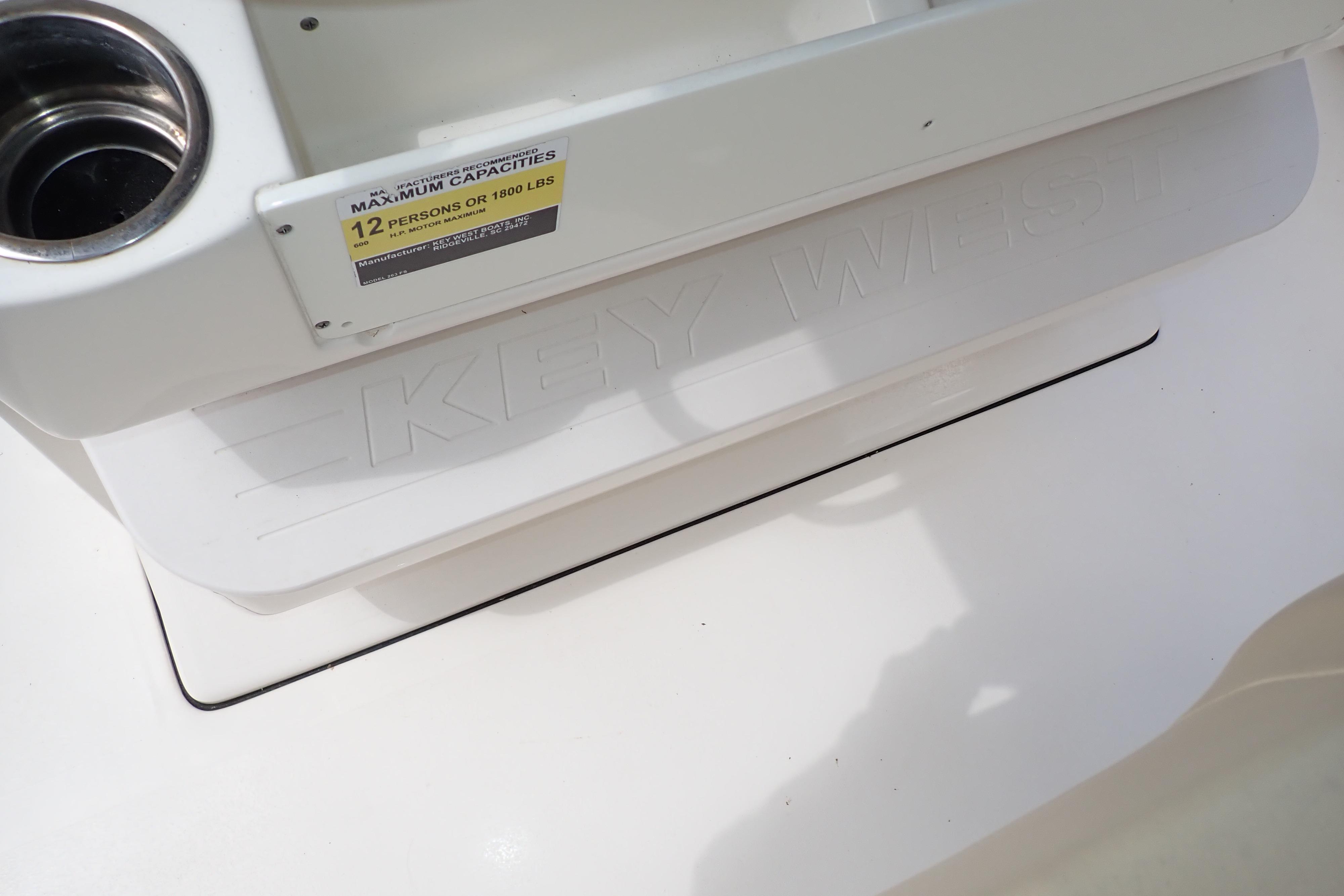 2019 Key West 263 FS boat, 12-person capacity label, white interior detail.