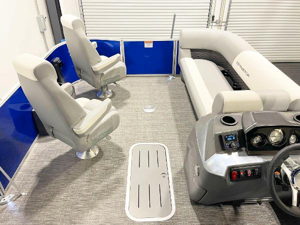 2025 Bennington 20S pontoon boat interior with gray seating and blue accents.