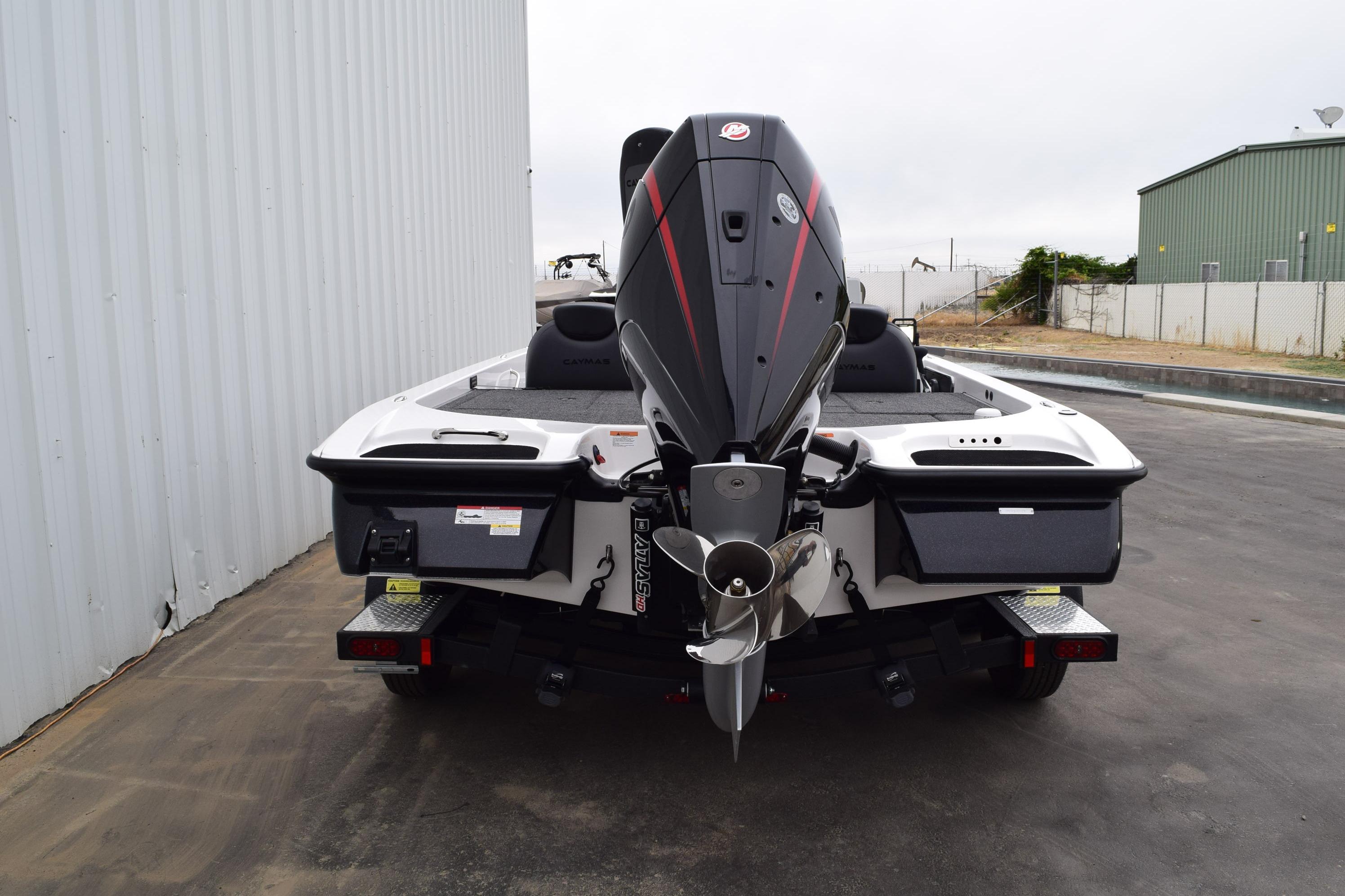 2027 Cayams CX 20 PRo boat rear view with powerful outboard motor.