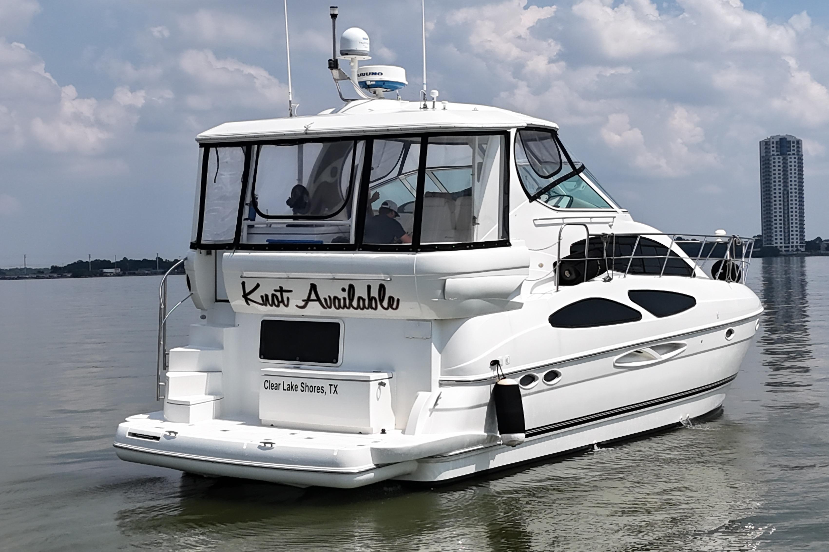 2004 Cruisers Yachts 405 Express Motoryacht on calm water, Clear Lake Shores, TX.