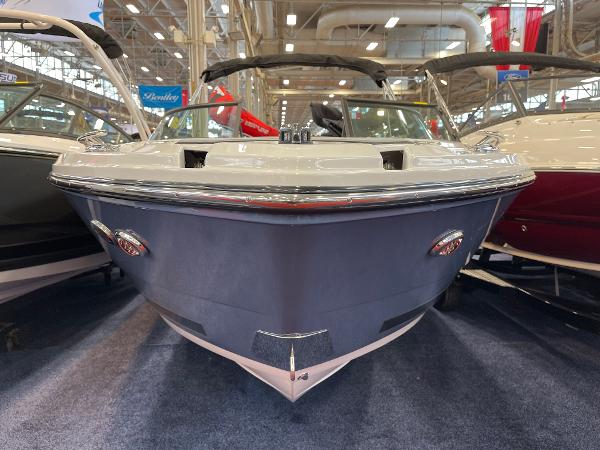 2025 Monterey 218 SS boat displayed indoors at a showroom.