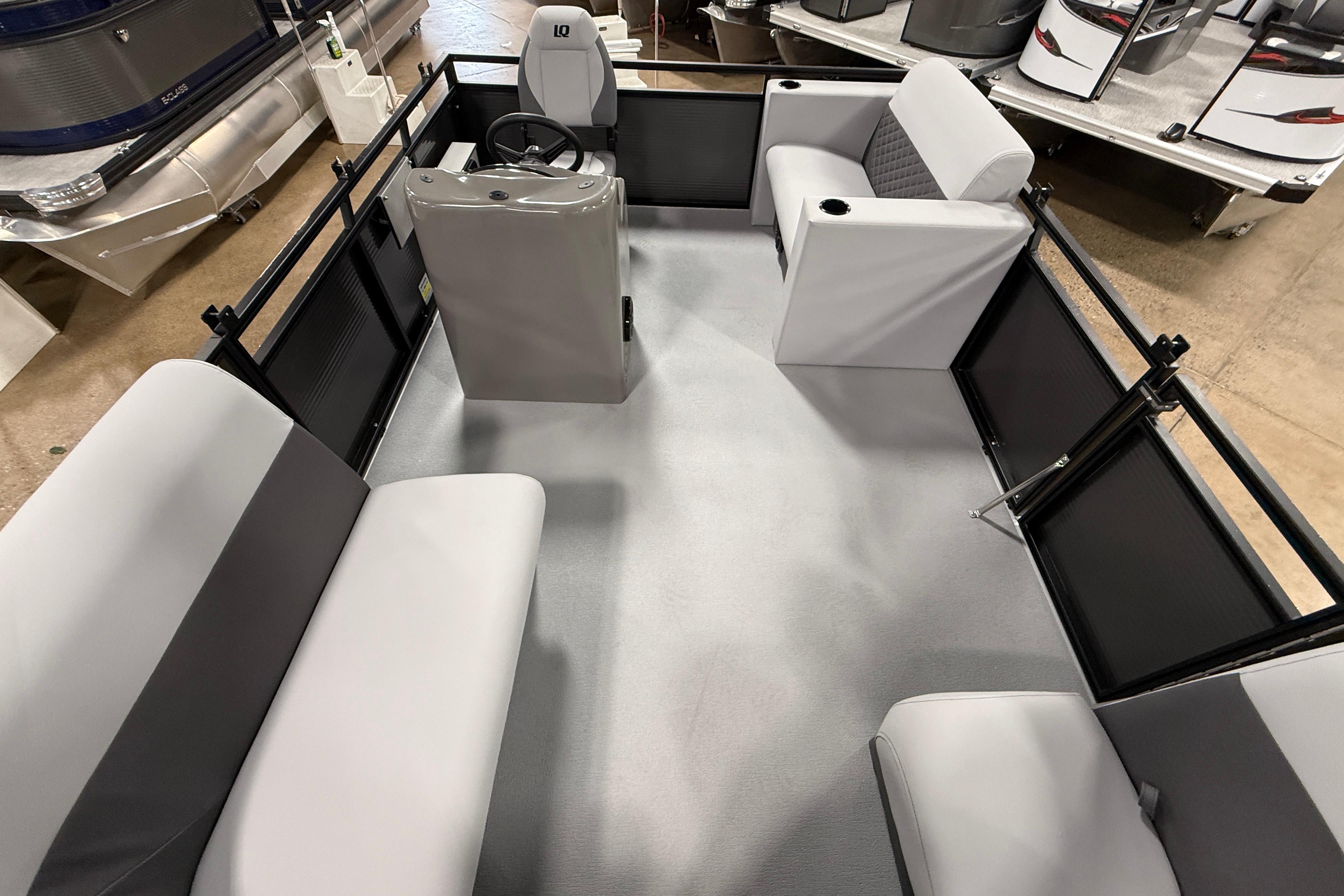 2026 Angler Quest 7515 Leisure Quest Cruise interior with seating and steering console.