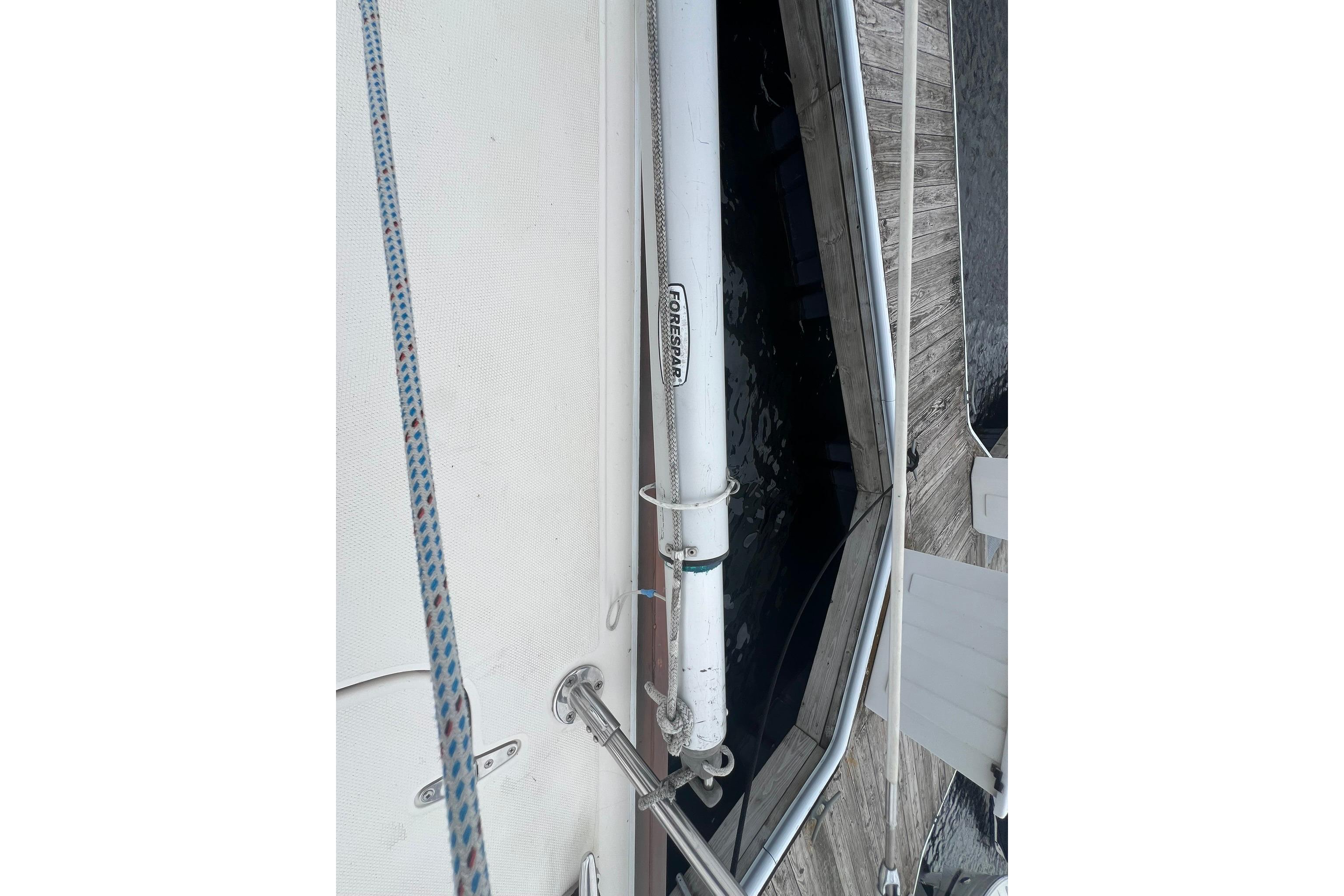 Deck view of a 1998 Sabre 362 sailboat, featuring rigging and dockside details.