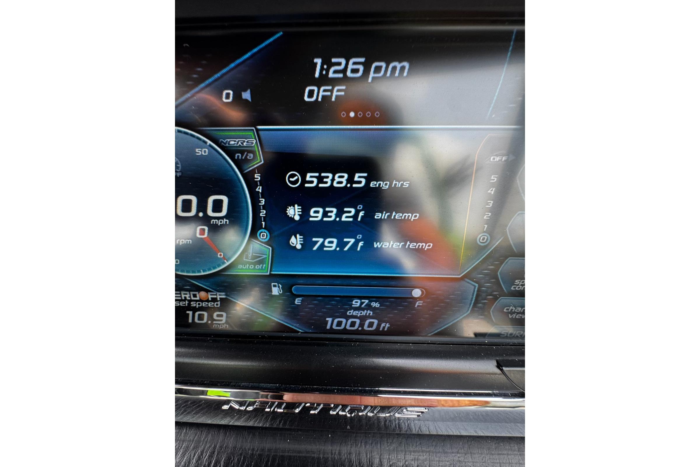 Dashboard display of a 2014 Nautique Super Air Nautique G21 boat showing engine hours and temperatures.