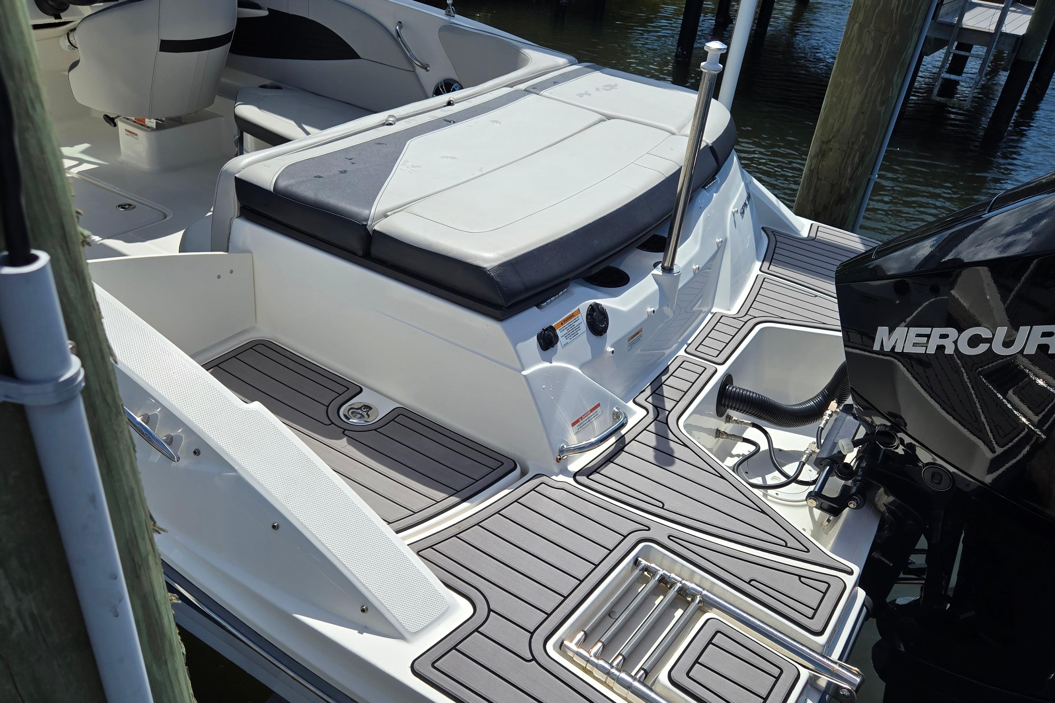 2023 Sea Ray SPX 210 boat with Mercury engine, featuring sleek deck design and comfortable seating.